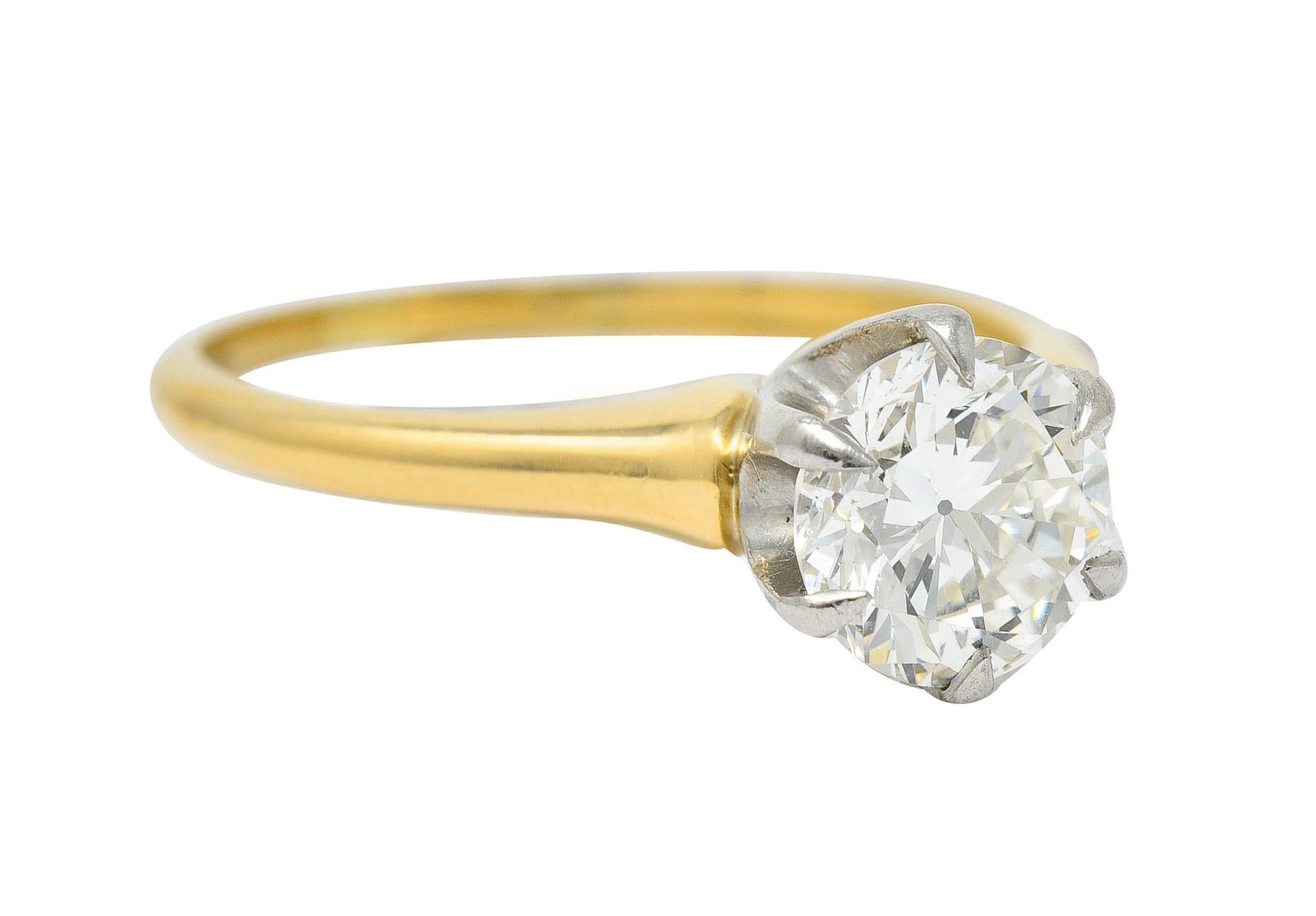 Classic solitaire ring centers a round brilliant cut diamond in a six pronged white gold head

Weighing 1.19 carats with J color and SI1 clarity

Completed by a yellow gold shank

With maker's mark and stamped 14K for 14 karat gold

Numbered and