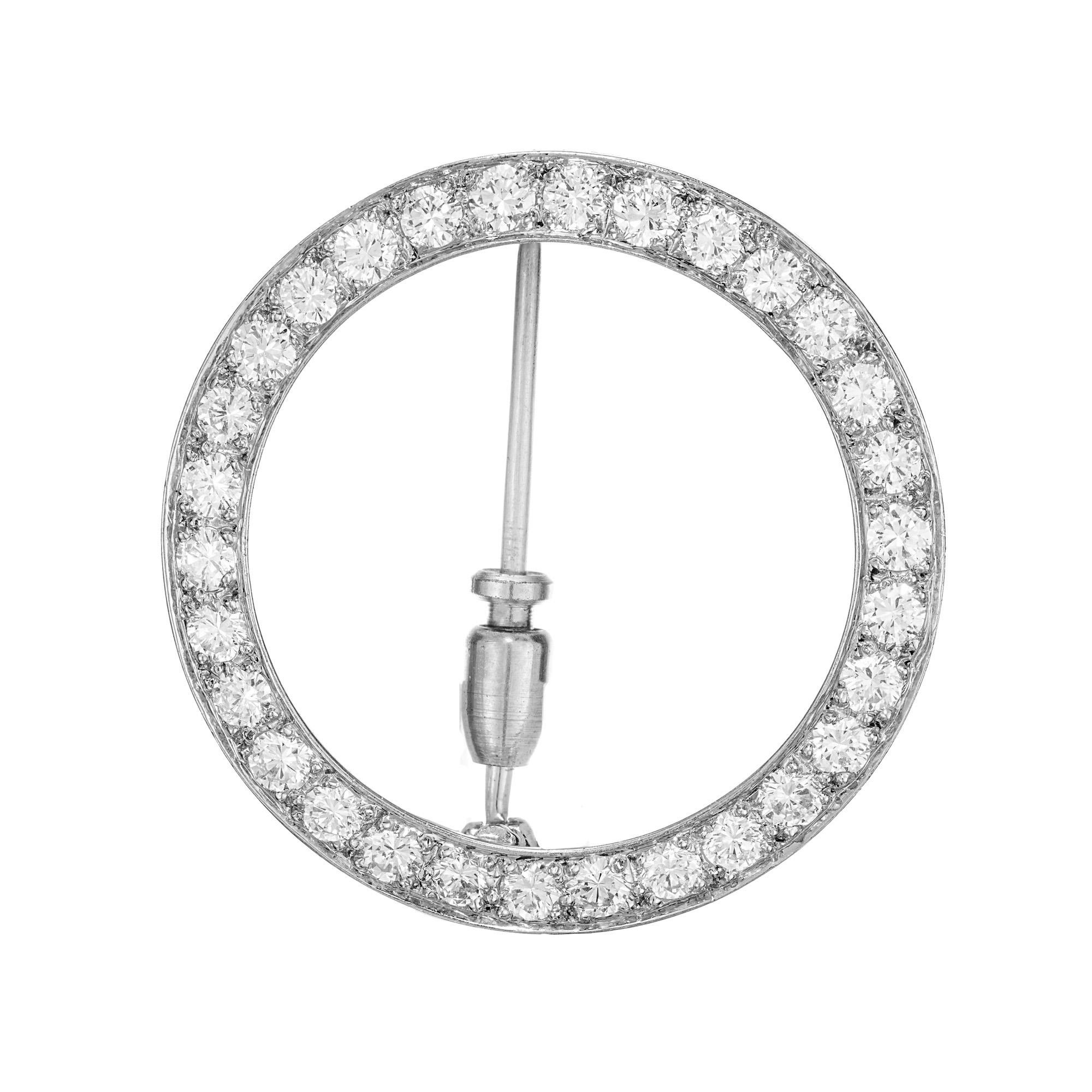Vintage 1950's J.E. Caldwell of Philadelphia diamond brooch. 30 round brilliant cut diamonds in a circular platinum setting. 

30 round brilliant cut diamonds, G-H VS approx. 1.20cts
Platinum
Hallmark: JEC
5.2 grams
Top to bottom: 28.5mm or 1.12