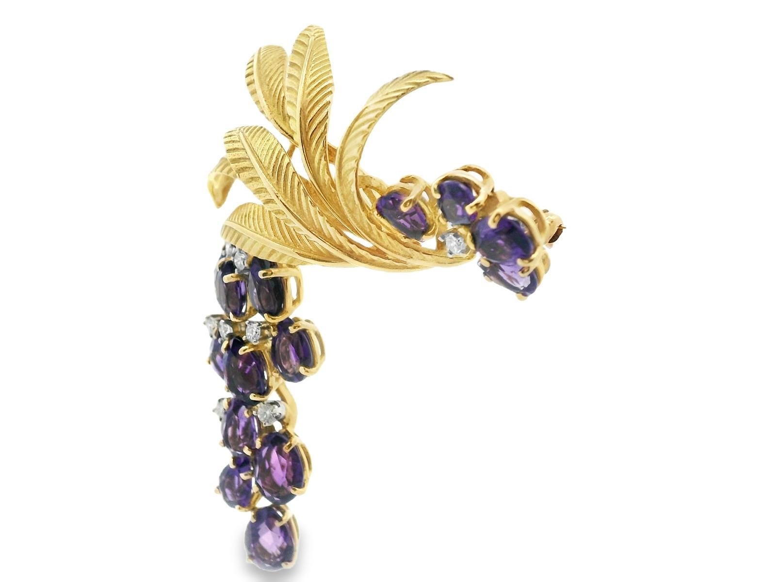 This stunning diamond and amethyst grapevine & grape brooch was made by J.E. Caldwell in the 1970s and is full of color. The leaves are are made in 18k yellow gold and are engraved to add incredible life-like feel. The grapes are made with a total