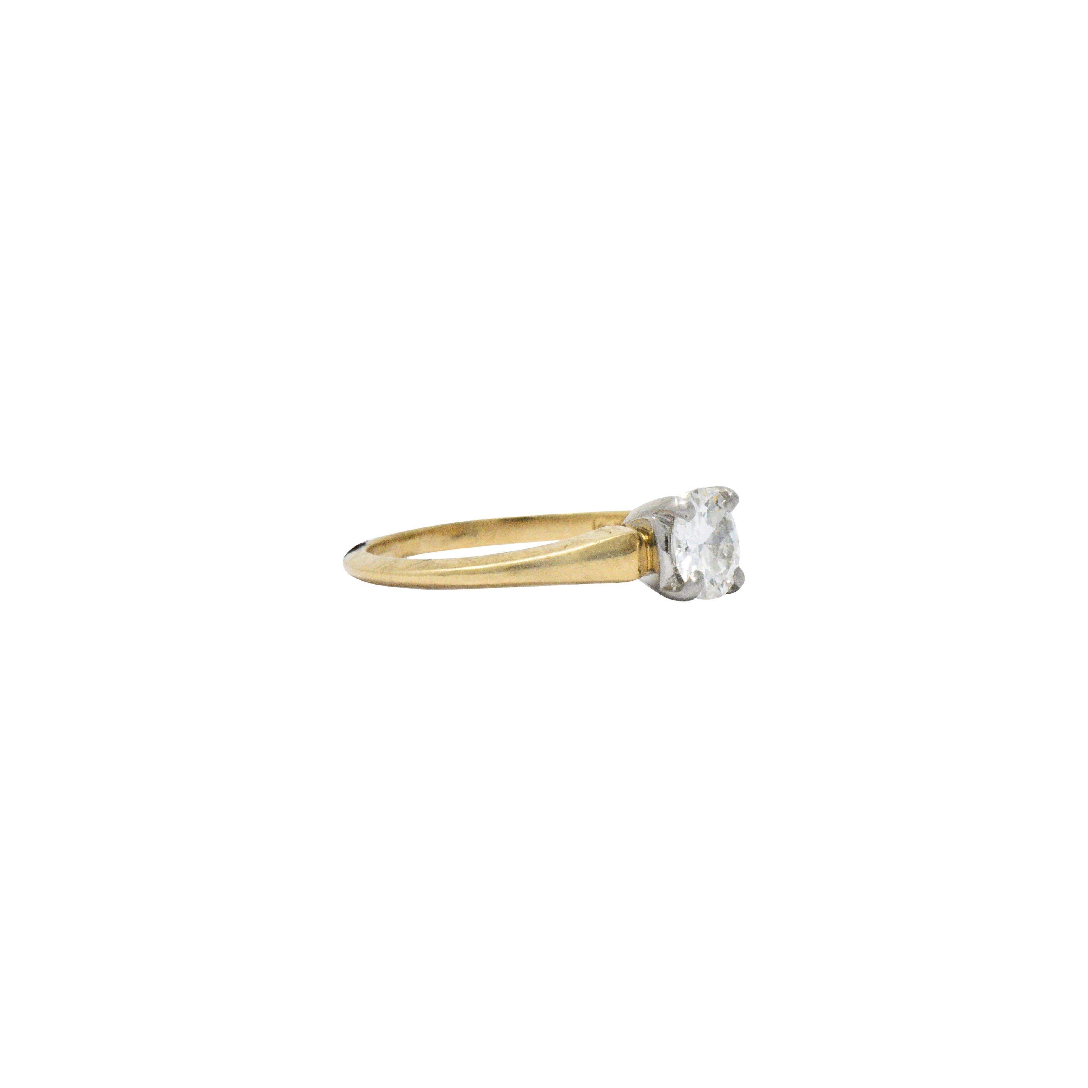 Centering an old European cut diamond weighing 0.61 carats, G/H color and VS clarity

Signed J.E.C. & Co. and numbered P 9204

Setting constructed of 14k yellow gold with platinum head

Ring Size: 5 & Sizable

Top measures 5.6 mm and sits 4.8 mm
