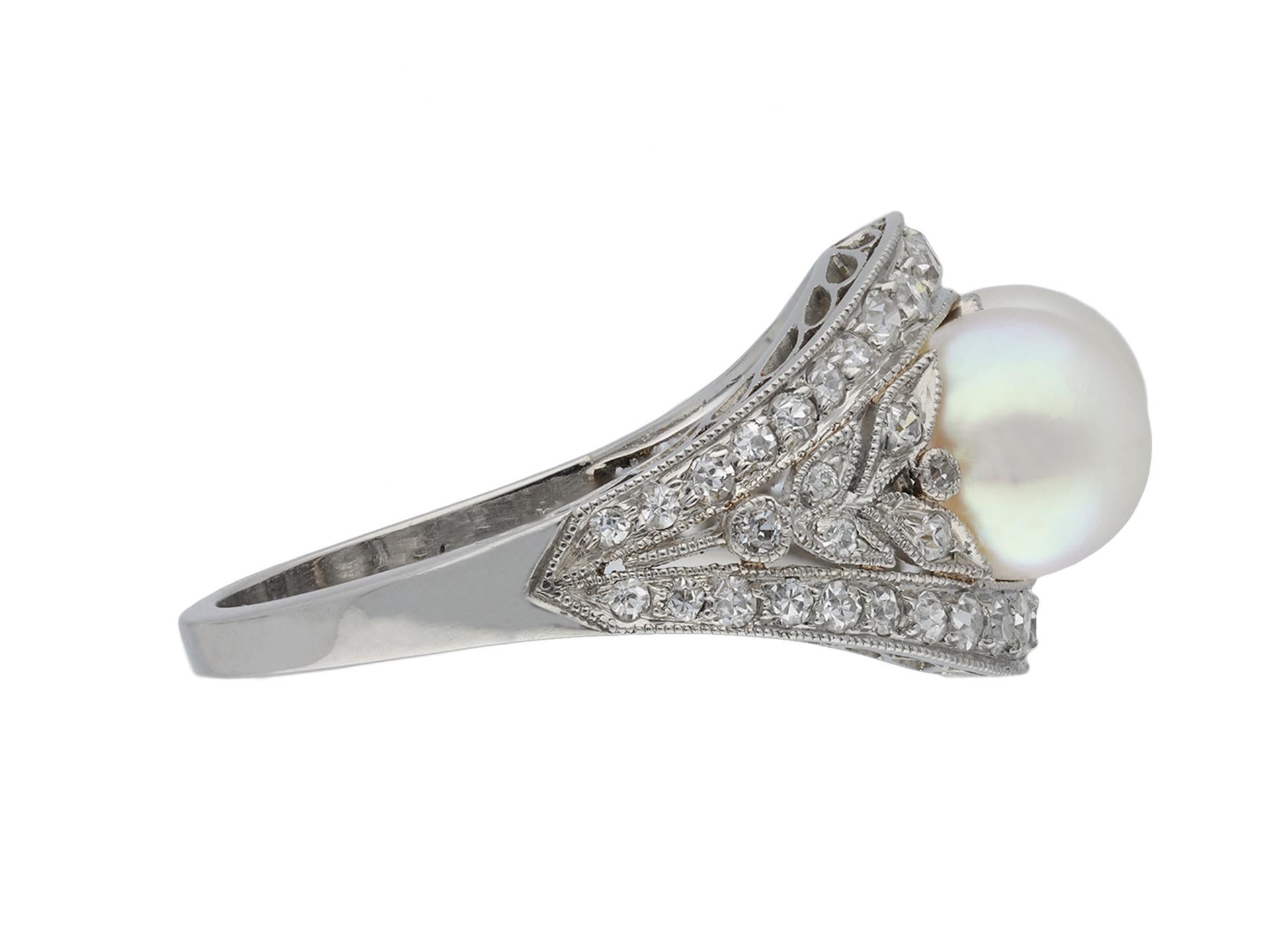 J.E. Caldwell antique natural pearl and diamond two stone ring. Centrally set with a pair of round natural saltwater pearls, approximately 6.6 - 6.7mm, in a closed back half drilled setting, further adorned with fifty six round single cut diamonds