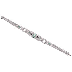 J.E. Bracciale Caldwell Art Deco in platino con diamanti, smeraldi e onice da 6,60 carati