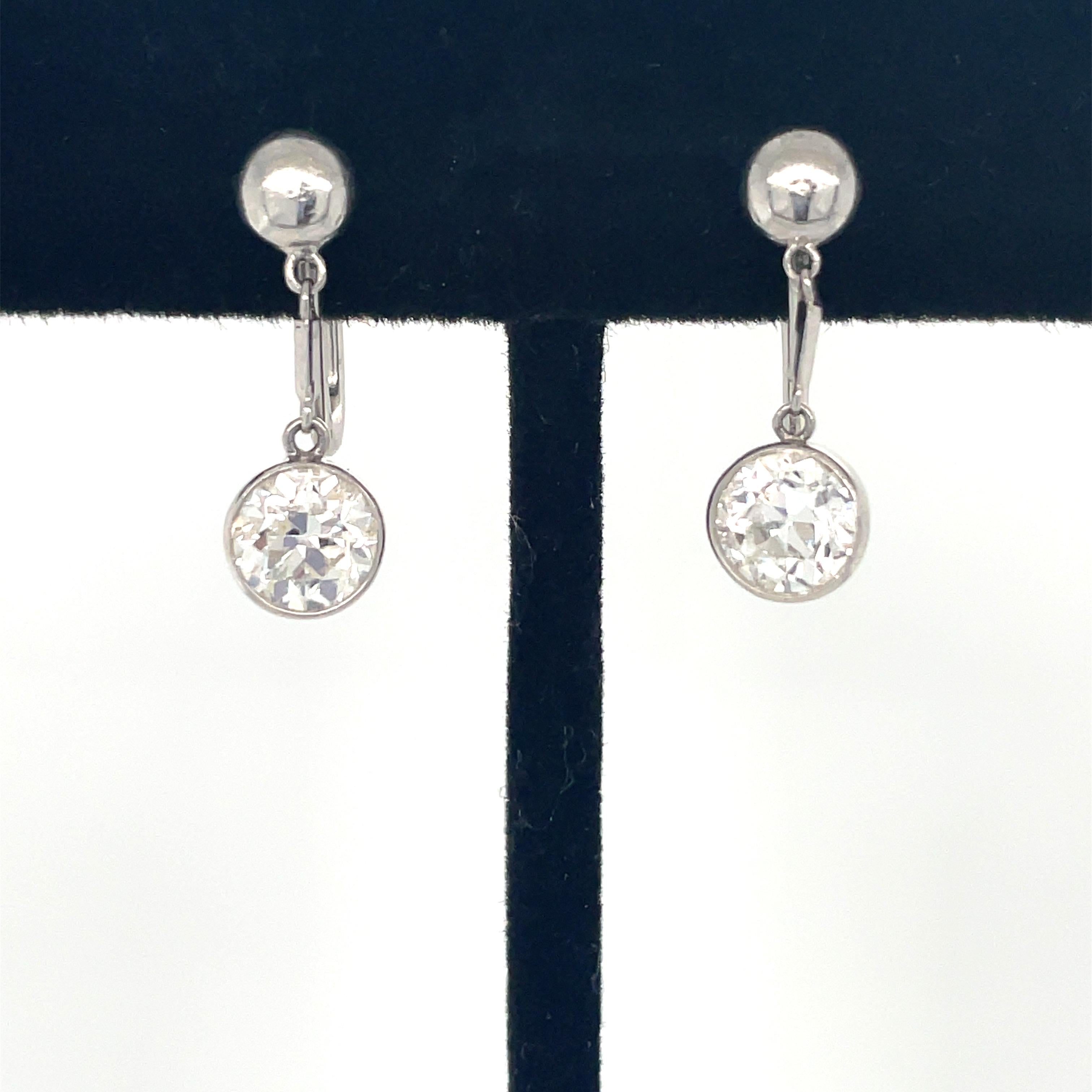 These dainty earrings designed by J.E. Caldwell feature two old European cut diamonds weighing approximately 1.50 carats total. Mounted in 14 karat white gold with screw backings, these earrings are simply gorgeous.

Measurements: 3/4 inch