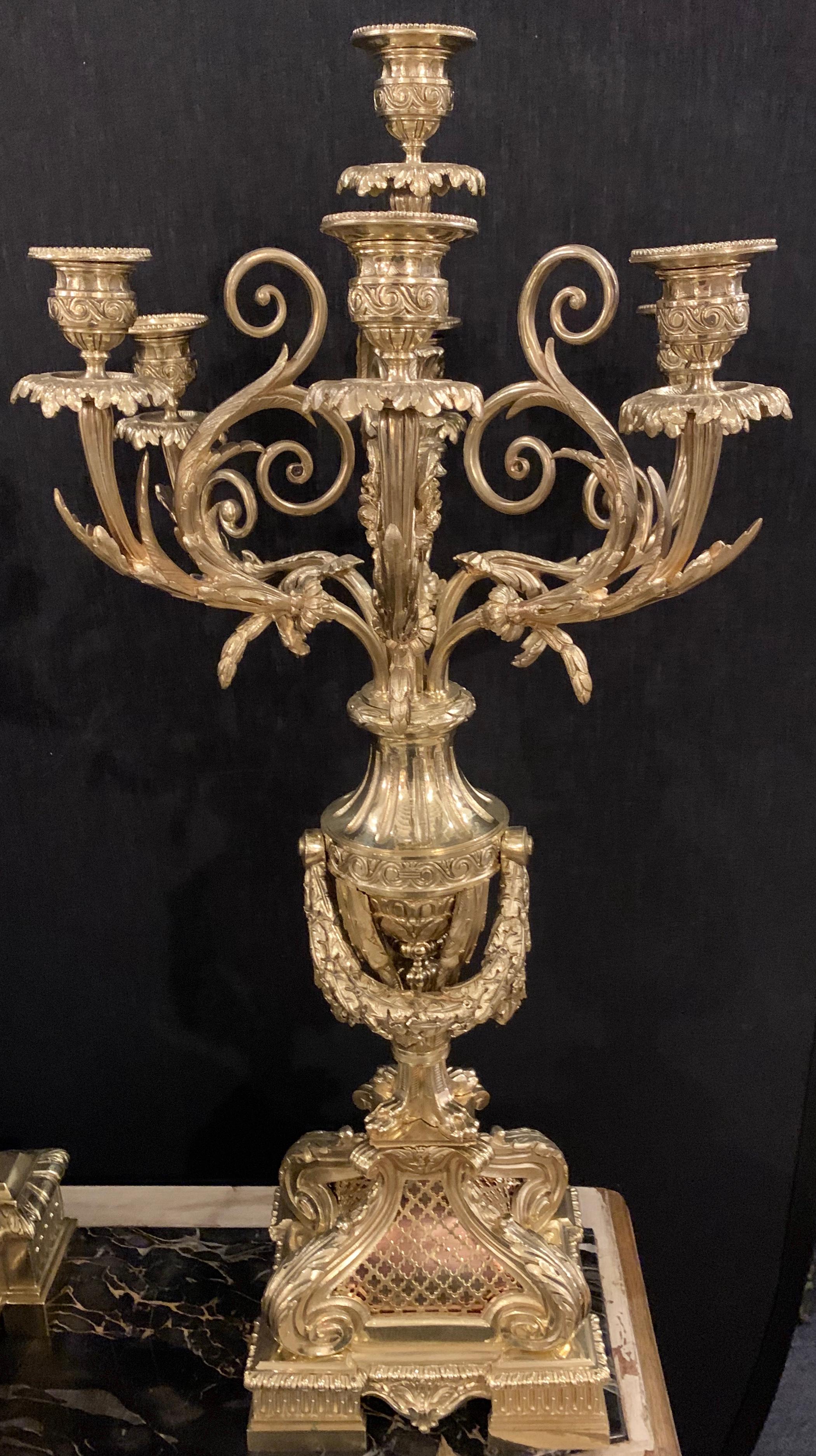 19th century J E Caldwell & Company three-piece Garniture clock set. Pair of candlesticks is large and impressive. Signed and Dated 1882. This fine heavy bronze mounted clock set with garnitures is simply stunning by the renowned J G Caldwell. In