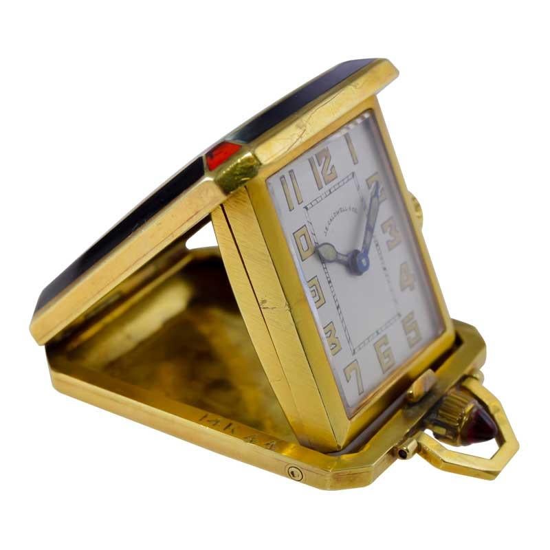 FACTORY / HOUSE: Mimo for J. E. Caldwell 
STYLE / REFERENCE: Art Deco Pocket Desk Clock
METAL / MATERIAL: 14kt Yellow Gold and Kiln Fired Enamel 
CIRCA / YEAR: 1930's
DIMENSIONS / SIZE: 1.25 X 1.50 Inches or Length 41cm X Width 32cm
MOVEMENT /