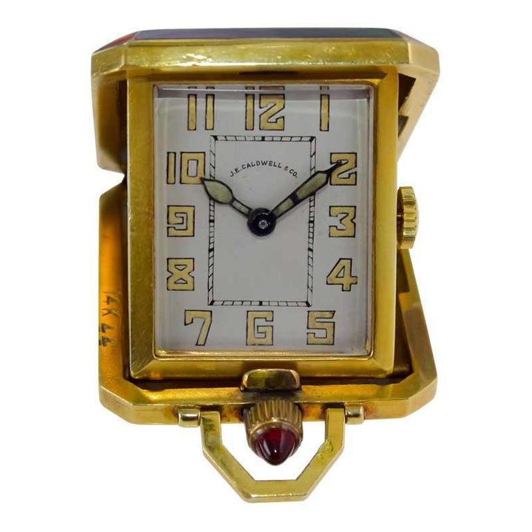 FACTORY / HOUSE: Mimo for J. E. Caldwell 
STYLE / REFERENCE: Art Deco Pocket Desk Clock
METAL / MATERIAL: 14kt Yellow Gold and Kiln Fired Enamel 
CIRCA / YEAR: 1930's
DIMENSIONS / SIZE: 1.25 X 1.50 Inches or Length 41cm X Diameter 32cm
MOVEMENT /
