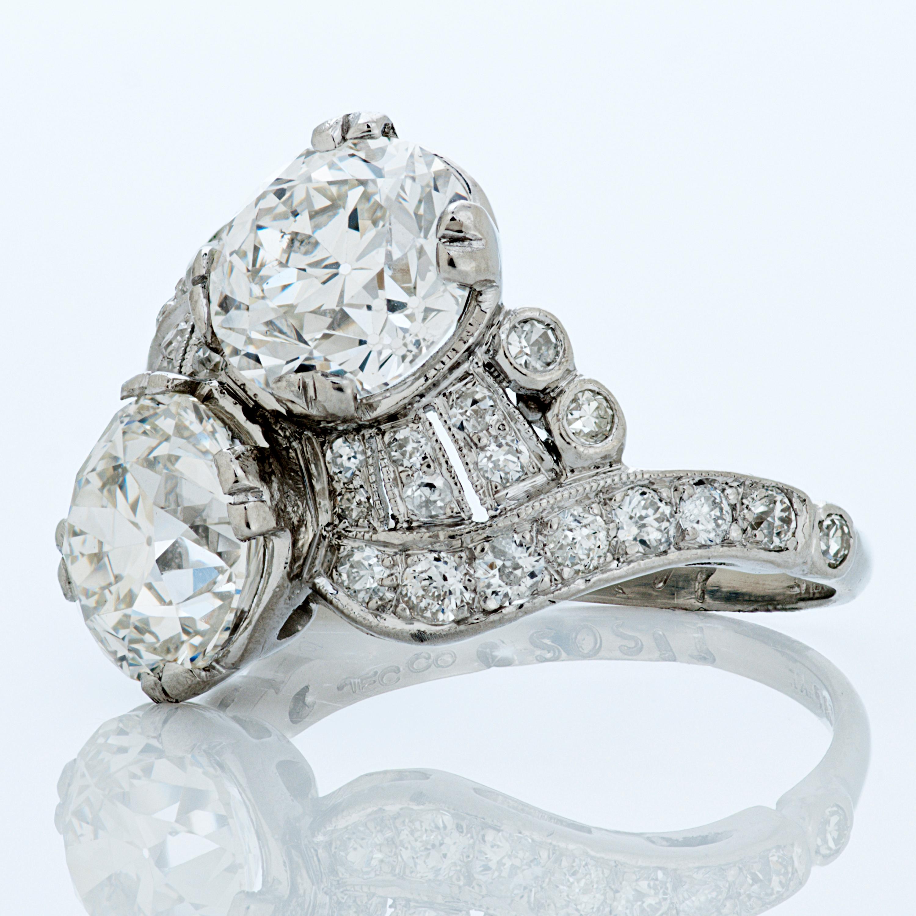 J.E. Caldwell & Co. Art Deco Old European cut diamond twin bypass ring set in platinum.

The centerpieces of this ring are two Old European cut diamonds both accompanied by GIA reports.  One weighs 2.10 carats with I color and VS2 clarity, the other