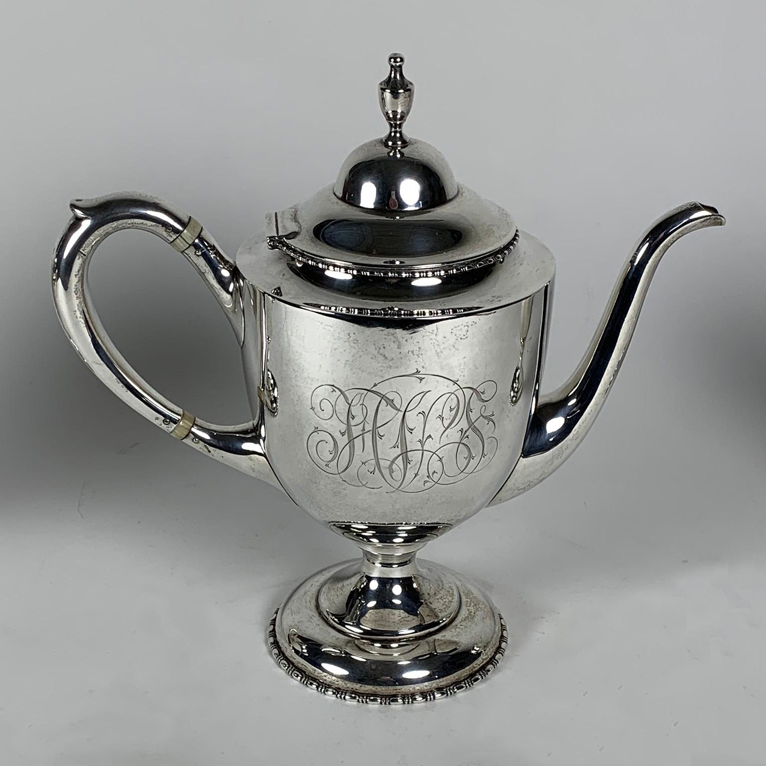J.E. Caldwell & Co. sterling silver tea service. Comprised of a teapot, covered sugar bowl and cream pitcher. Marked 