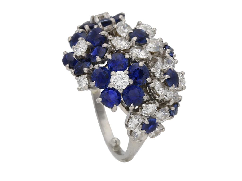 J.E. Caldwell sapphire and diamond flower cocktail ring. Set with thirteen round old cut natural unenhanced Burmese sapphires in open back claw settings with an approximate combined weight of 2.50 carats, additionally set with twenty round brilliant