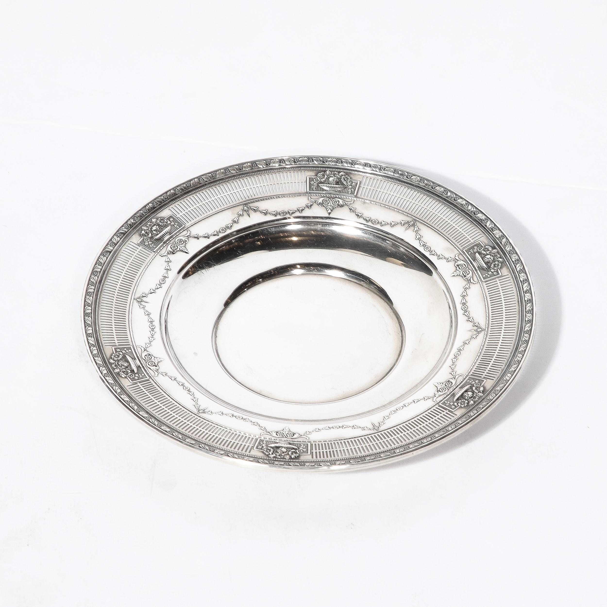 This remarkably detailed and refined Art Deco Sterling Silver Serving Bowl was made by J.E. Caldwell and originates from the United States, Circa 1930. A truly gorgeous piece rendered in gleaming Sterling Silver, the bowl is adorned with