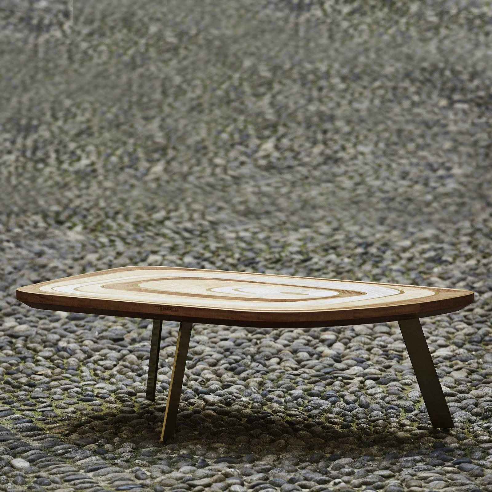 This exquisite coffee table was introduced at Milan Design Week 2018. Its unique silhouette comprises three slightly slanted legs supporting a rectangular top with rounded corners. The standout feature of this piece is the texture of the top that