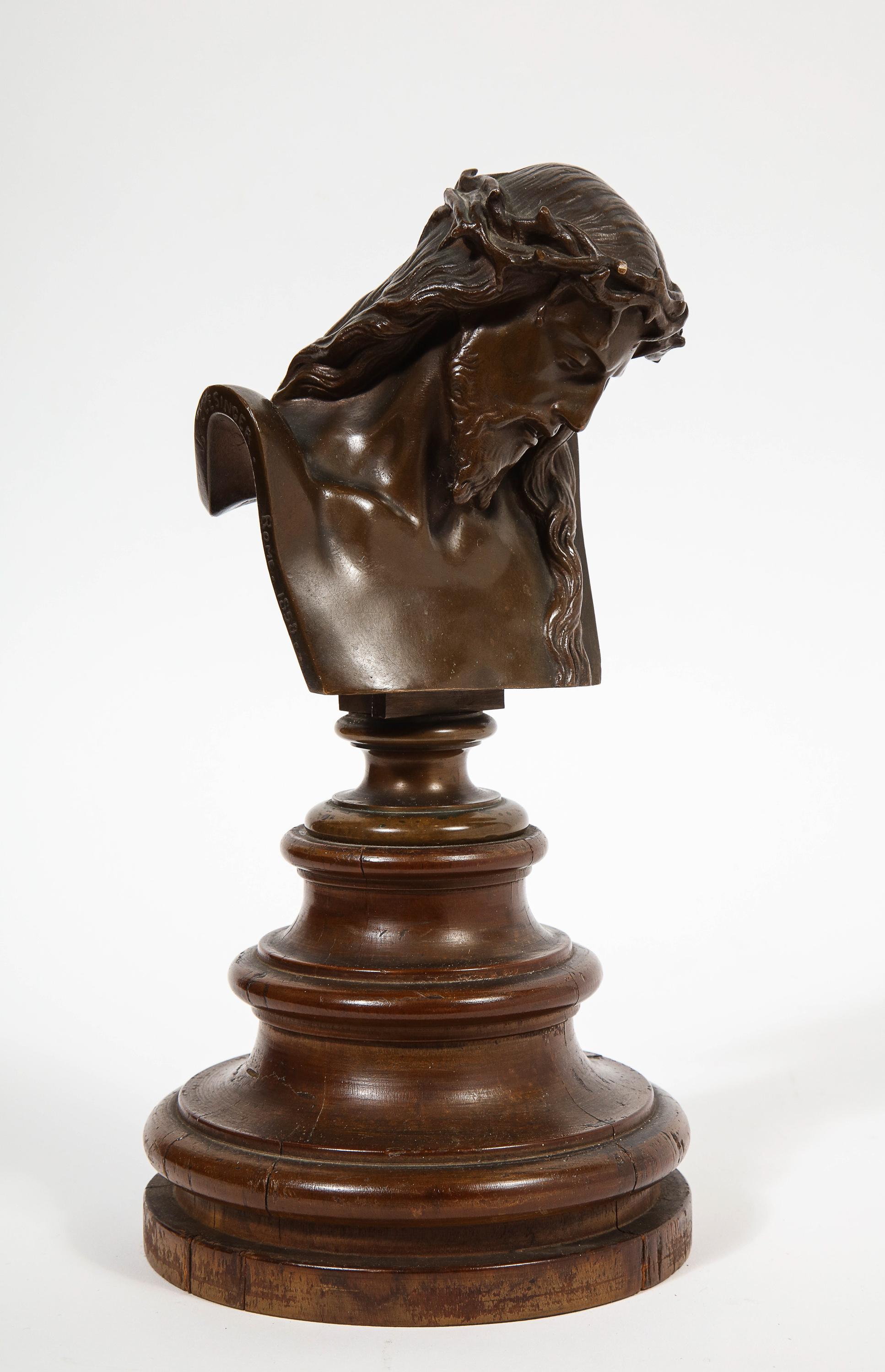 A French Miniature patinated bronze bust of Jesus Christ on a round wood base, 1858.

Signed: J CLESINGER. Rome. 1858 with F. BARBEDIENNE FONDEUR, with the Reduction Mecanique seal.

Overall: 10