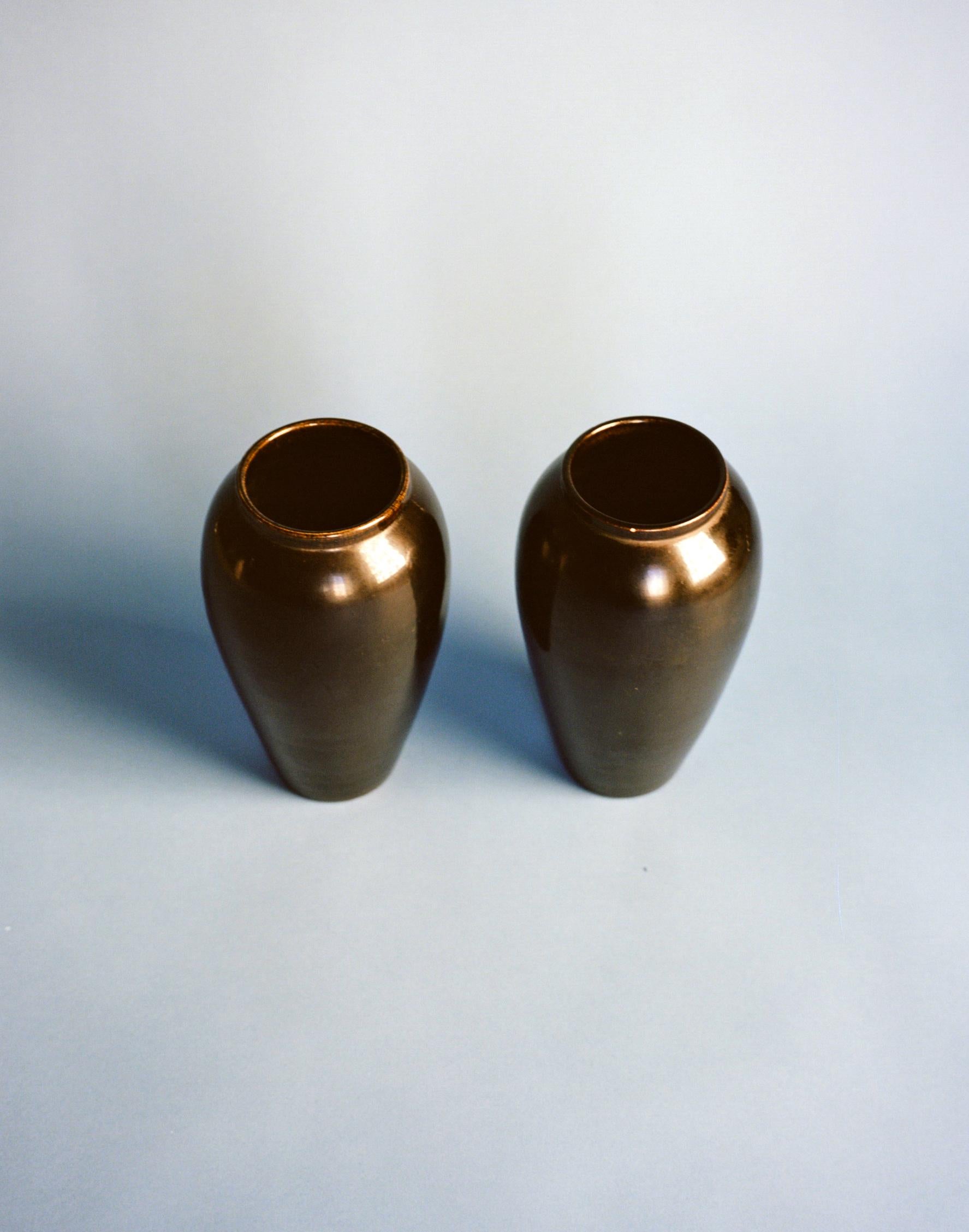 A pair of black glazed vases produced in Vallauris, France in the late 1930s. Each vase is signed 