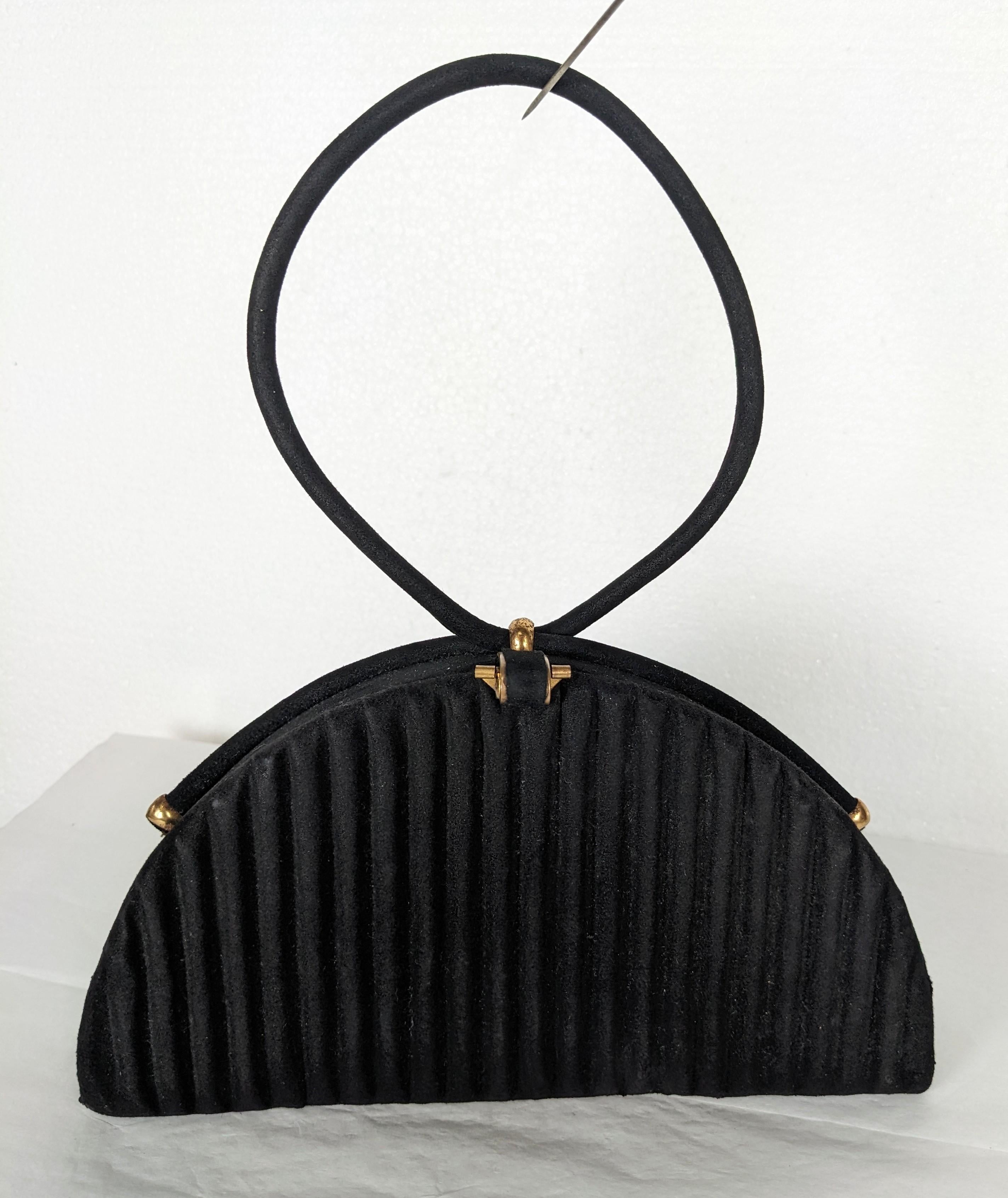 Charming Jean Bernard Figural black suede bag from Paris, 1950's. Black fluted half moon shape with tubular suede loop handle. Faille lining with various compartments. 8.5