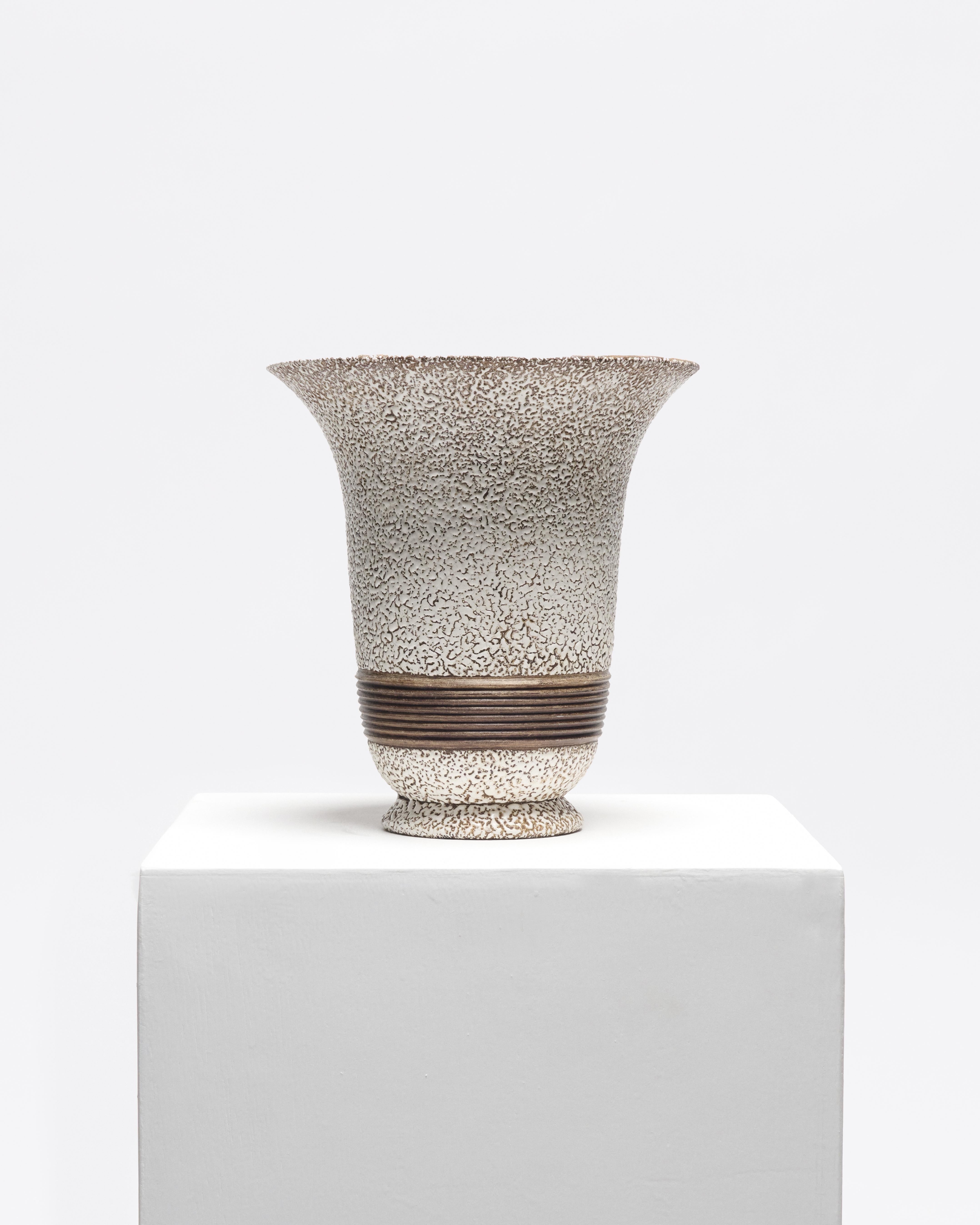 Jean Besnard was a leading figure of French ceramic art in the interwar period and was known for his deeply experimental glazes and architectural forms. Active primarily in the 1920s-1930s, Besnard pushed boundaries with surface texture, often