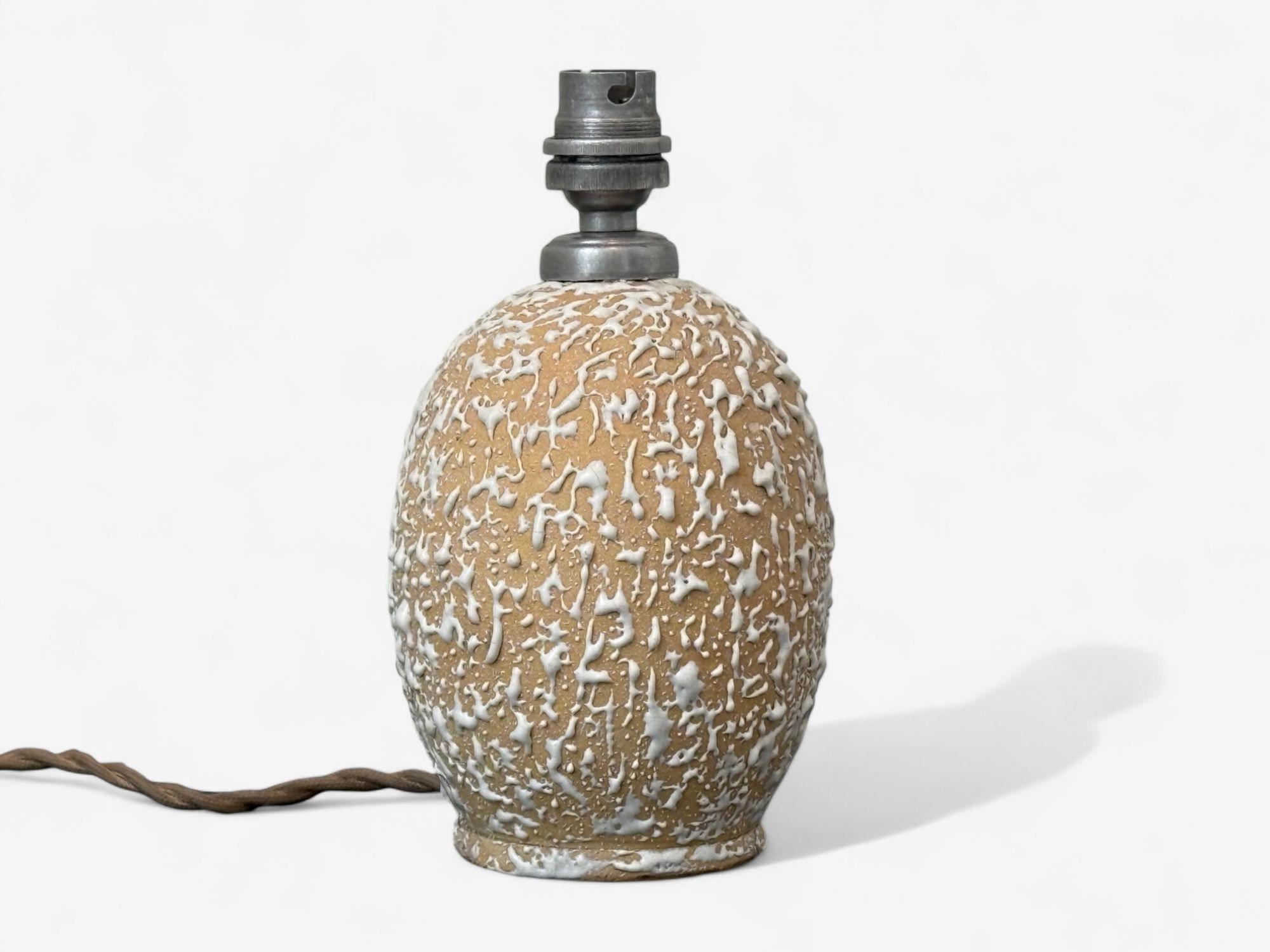 Jean Besnard, French Art Deco, Off-White Ceramic, Table Lamp, France, 1960s

A small cream color ceramic partially glazed table lamp designed and produced by Jean Besnard in France in the middle of the 20th century. This example is marked on the