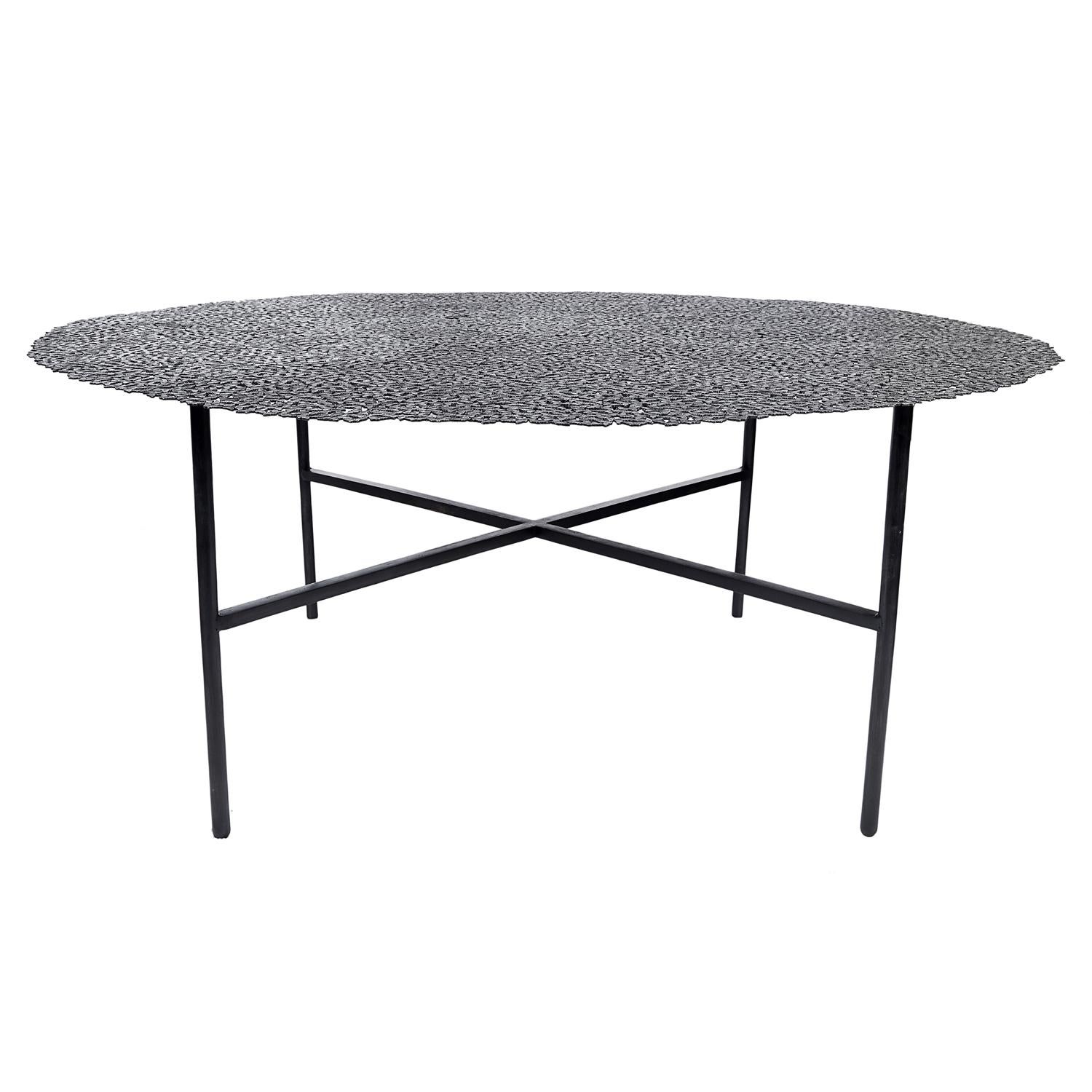 A swarm of butterflies as delicate as a lace table cloth forms an everlasting tabletop in blackened brass, lost wax cast by Italian master craftsmen. A sculptural table for both indoor and outdoor use.

Also available in bronze or white bronze. This