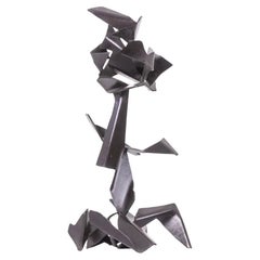 Jean Campa. Escultura geométrica de metal pulido. 1980s.