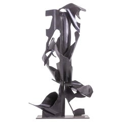 Jean Campa. Vertical sculpture in patinated metal. 1980s.