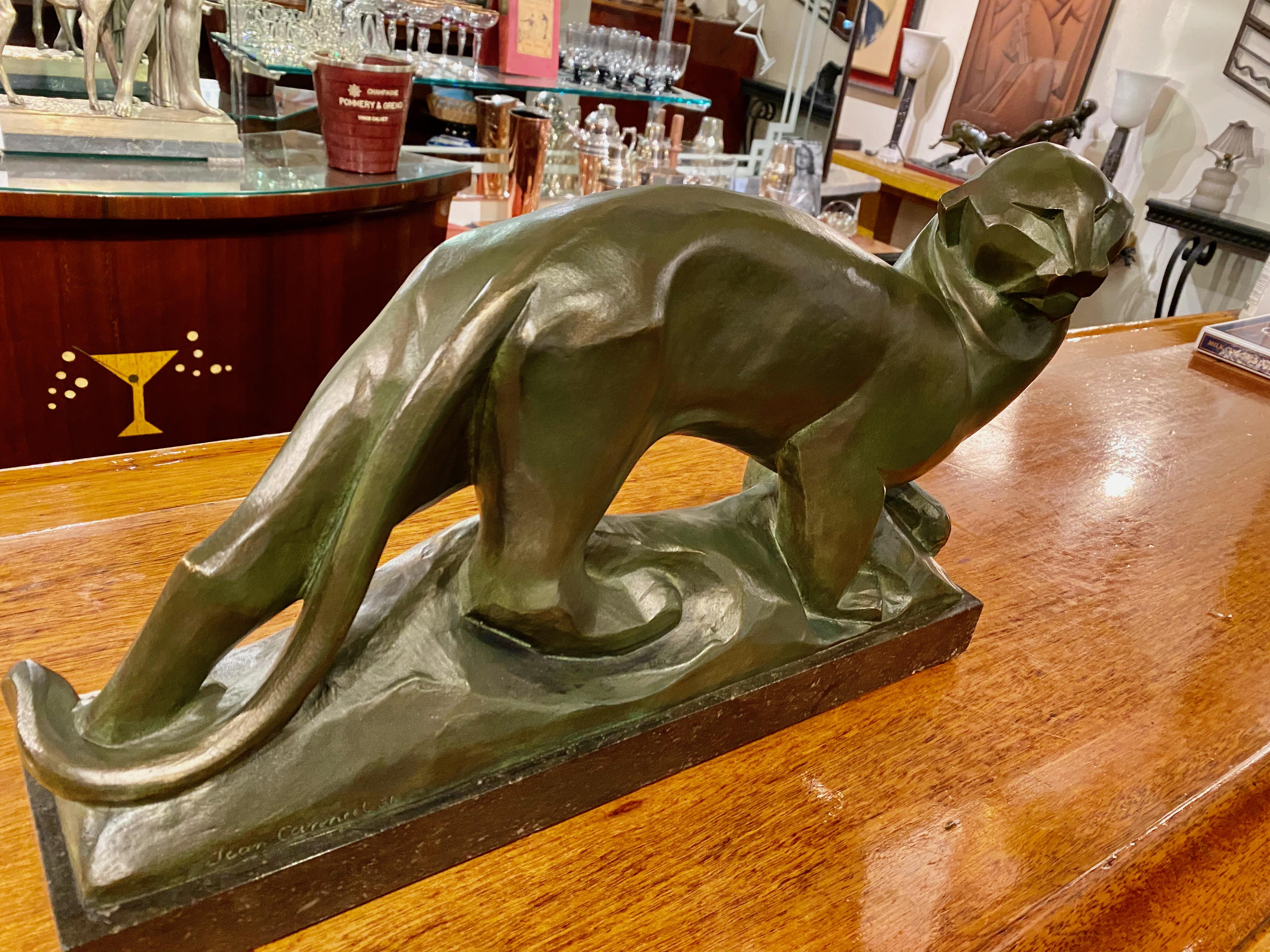 A Cubist Panther by Jean Canneel, an important Belgian Art Deco Era Sculptor. It is a striking design showing absolute mastery of bronze work with a cat portrayed in a uniquely stylized way. It is signed in the base by Jean Canneeel , who exhibited