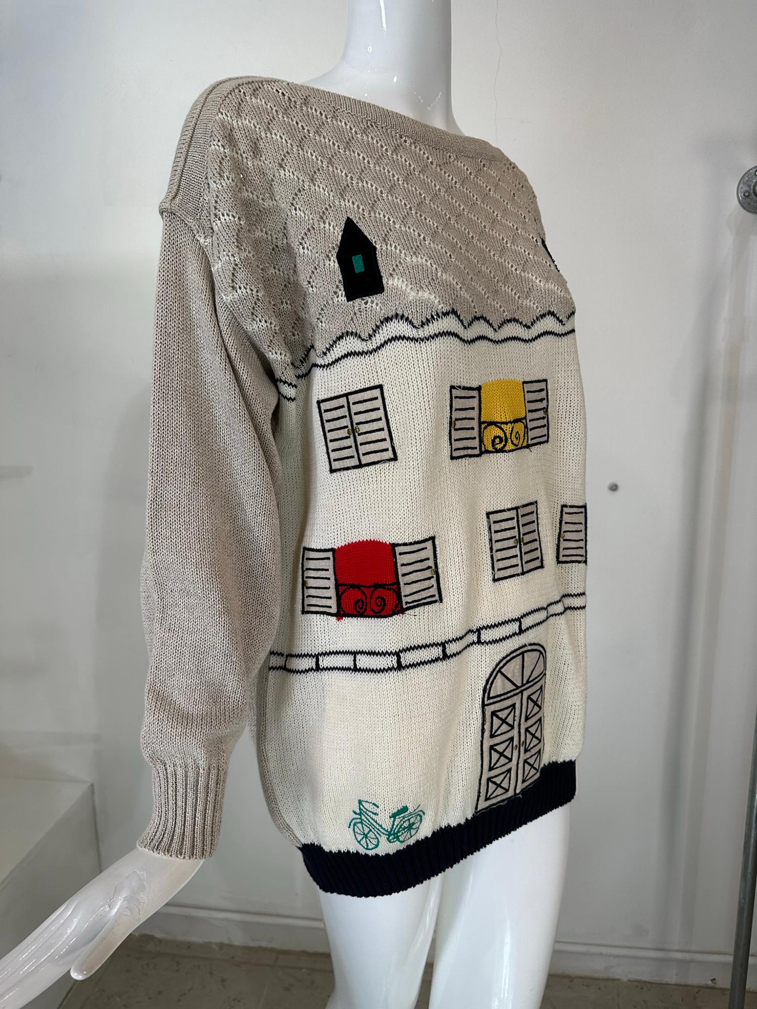 Jean-Charles de Castelbajac natural linen knit applique house with cat pullover sweater marked size 44. Pull on sweater is appliqued at the front with a charming house, the roof at the top has a cat on one side & an attic window on the other, the