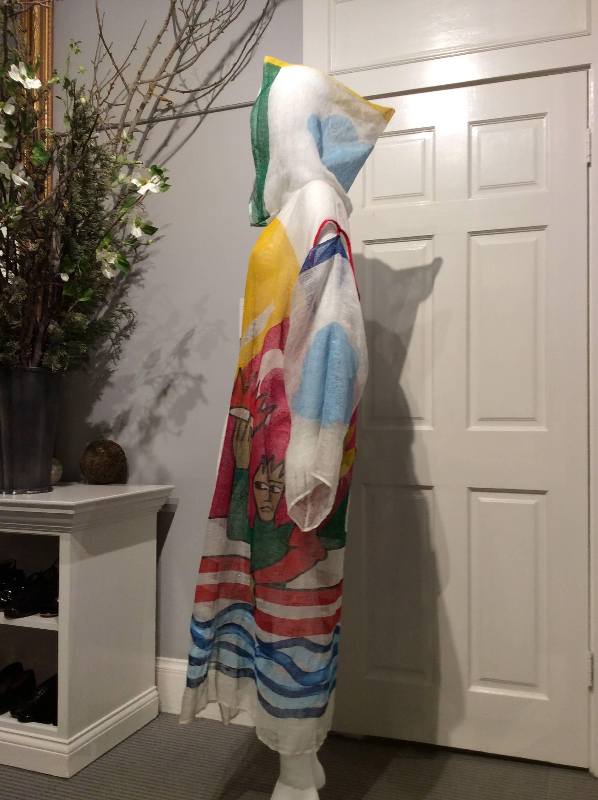 Vintage Jean-Charles de Castelbajac open long caftan with hood. The linen fabric is hand painted in bright colors on an ivory background. It has removable kimono sleeves attached on each side by three buttons.