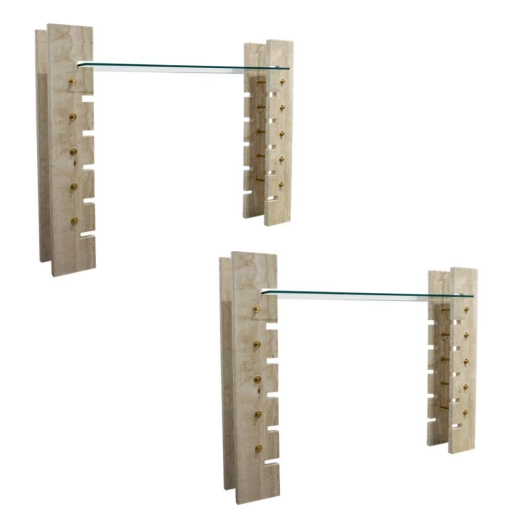 A pair is available, vintage French Consoles of Urban Architectural Design, entirely handcrafted, acquired from a private Roman interior designed by Jean Charles. Minimalist Modern design with two upright structural supports in travertine connected