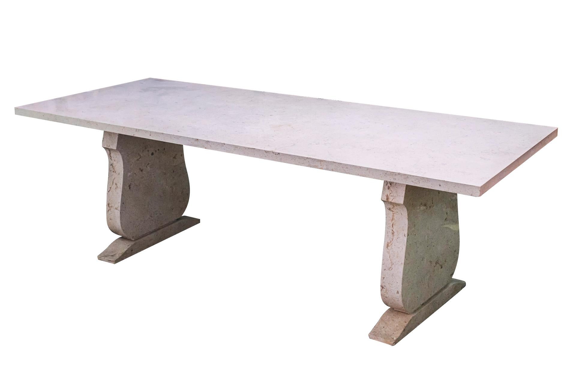 Jean-Charles Moreux (1889-1956),
Dining room table in the style of the Antique,
Burgundy stone, neoclassical feet,
France, circa 1940.

Measures: Depth 100.5 cm, height 76.5 cm, width 240.5 cm.