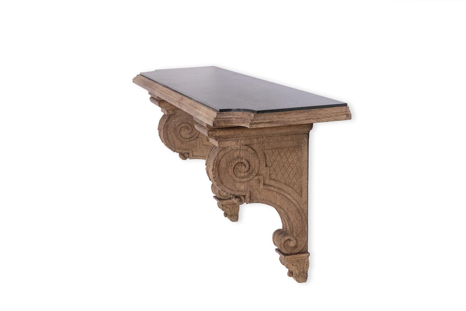 Carved oak console, the two wall consoles decorated with scrolls, scrolls and acanthus leaves, now a green marble top with curved corners.

French work realized in the 1940s.

Dimensions: H 61 x W 146 x D 36 cm

Reference: LS4538689J