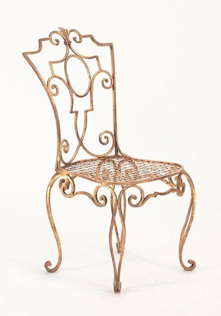 Set of six French gilt iron chairs by Jean-Charles Moreaux. All of the chairs have a nice decorative pattern. 

