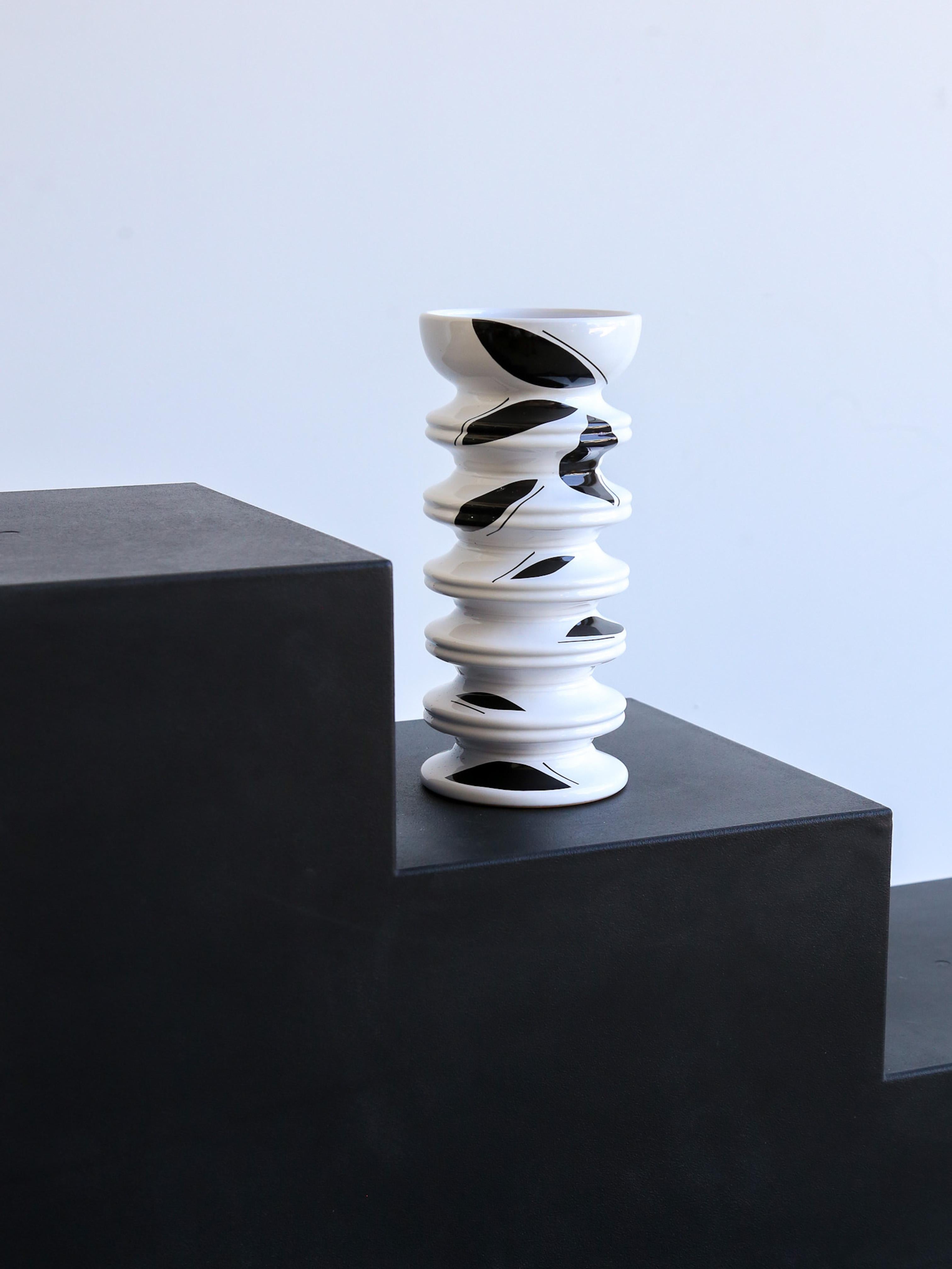 The different souls of nature resonate together. Clay vase, hand thrown with a glossy white glaze finish and black art work. 

Jean Christophe Clair eagerly devoured every book and score, searched for interesting stimuli and themes and built new