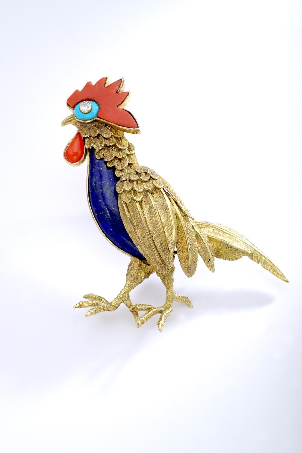 Jean Claude Champagnat realised many pieces for Christian Dior in the 1960.
Significant Diamond Lapis Lazuli Turquoise Gold Rooster Brooch.
French marks and maker's mark.
Signed Jce for Jean Claude Champagnat.

Gross weight: 26.83 grams.