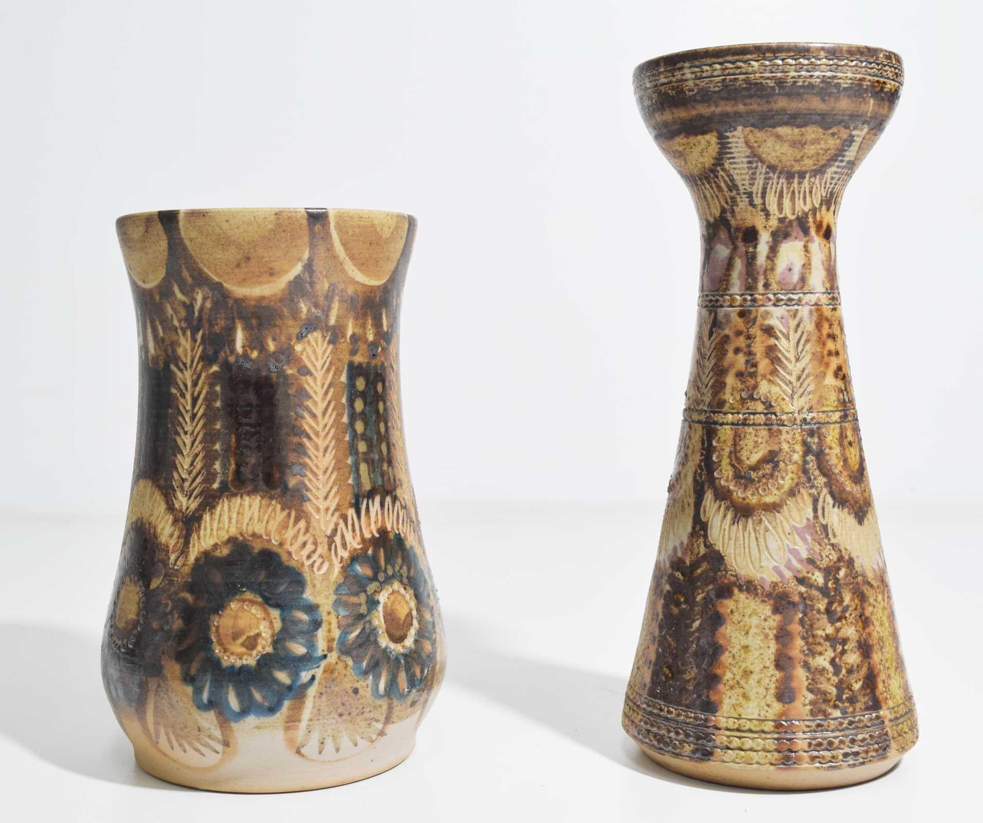 Beautiful ceramic vases with flower motif by Jean-Claude Courjault. Measures: Largest is 10.5
