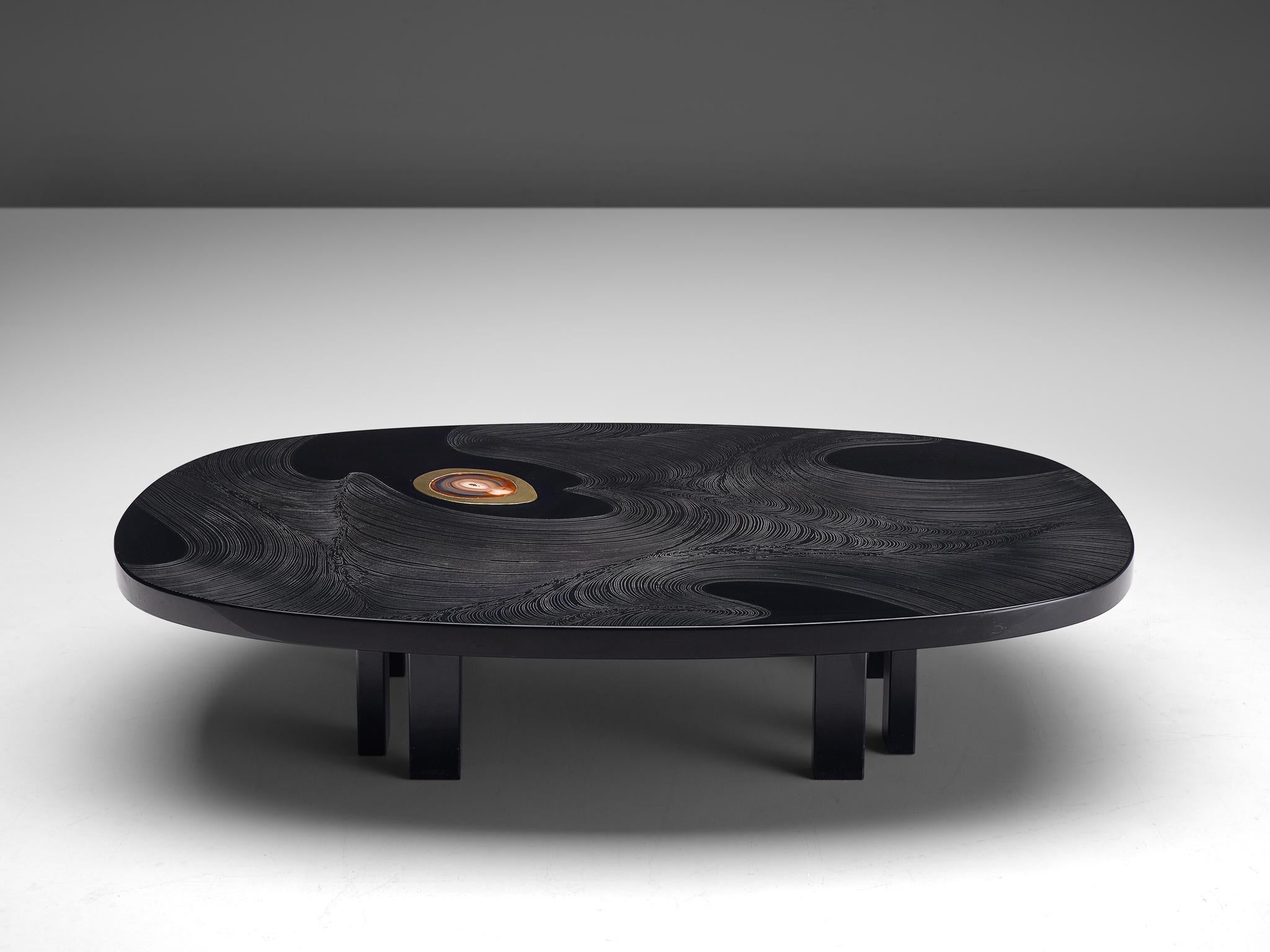 Jean Claude Dresse, coffee table, black resin, brass, agate and steel, Belgium, 1980s

A cocktail table crafted with high attention for detail which is characteristic for the work of the Belgian artist Jean Claude Dresse. This coffee table is