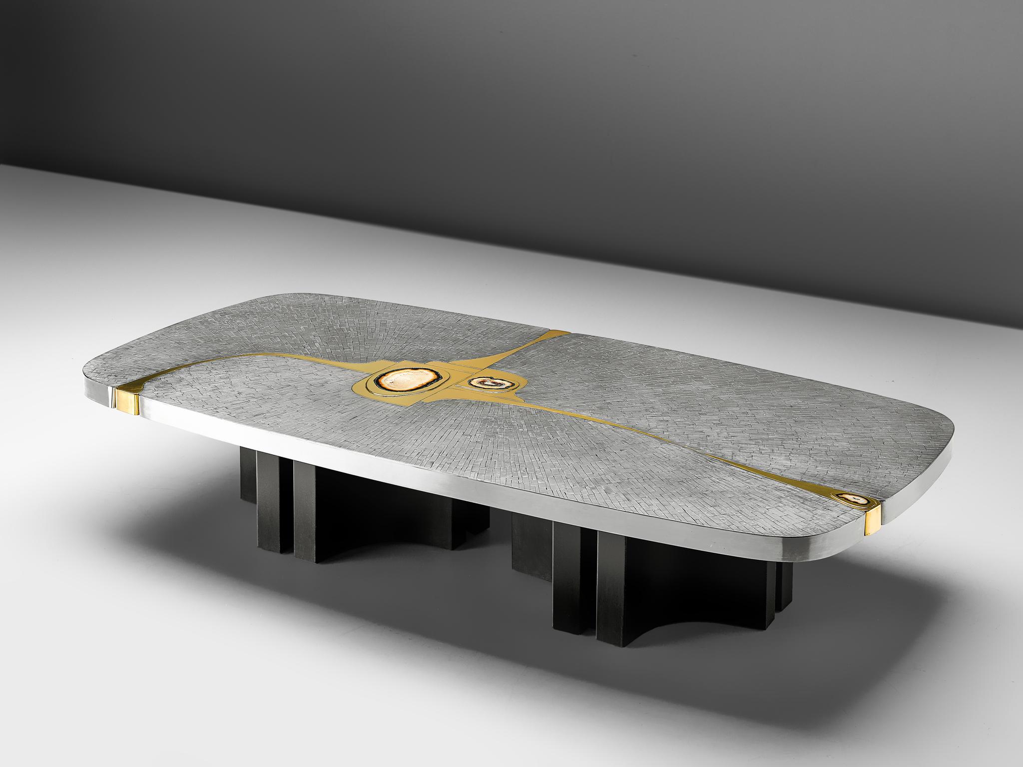 Jean Claude Dresse, coffee table, brushed stainless steel, brass and agate, Belgium, circa 1970

This extraordinary piece was crafted with great eye for proportions and detail, typical for the work of Dresse. The combination of materials, steel,