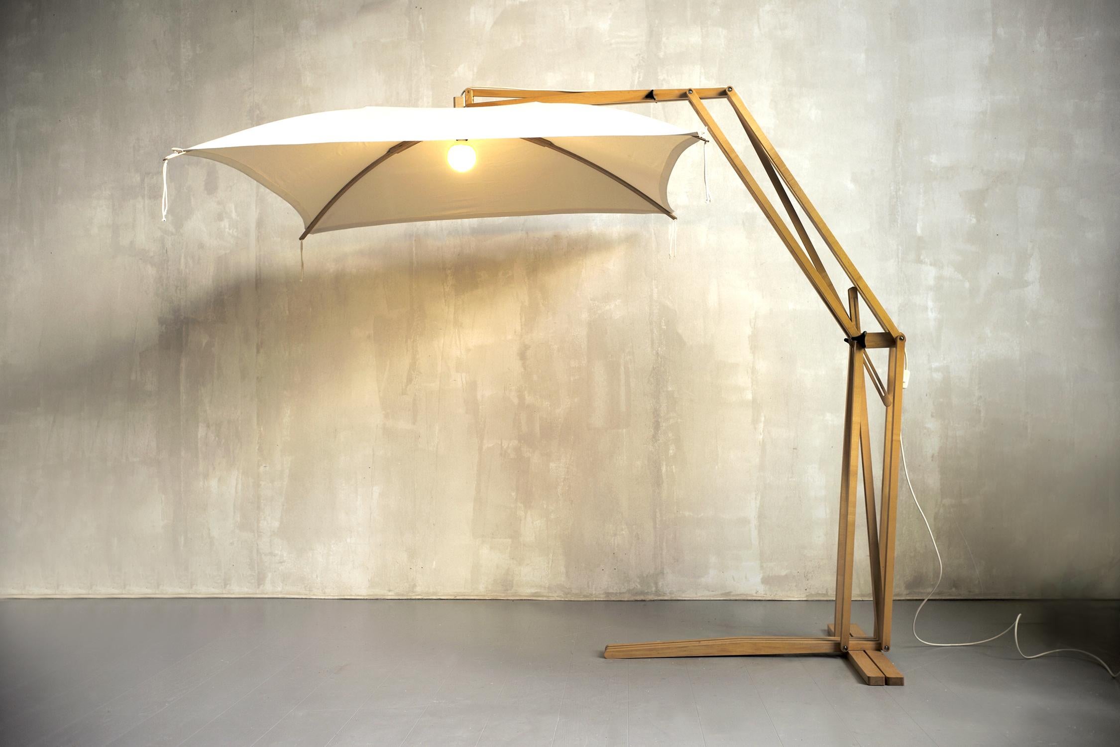 Jean-Claude Duboys, Important floor lamp in satin maple and linen, France 1980. The Parasol floor lamp has joints fitted with brakes, allowing adjustment of the height and orientation of the reflector. Created as part of the Attitude program in the