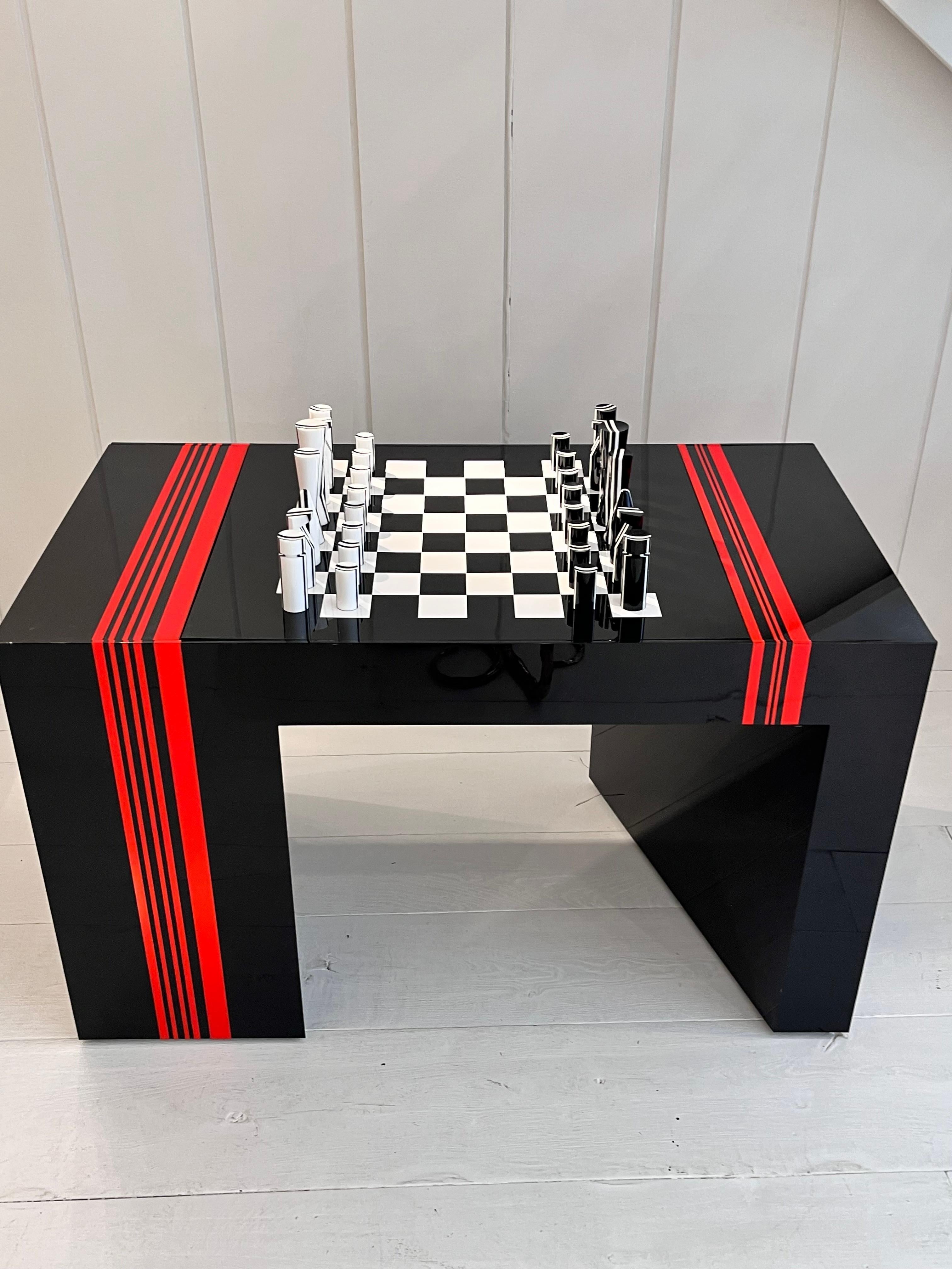 Backgamon, checkers and chess table in black, red and white methacrylate,
Unique piece.
Jean-Claude Farhi (1940-2012) methacrylate game table.
   �       