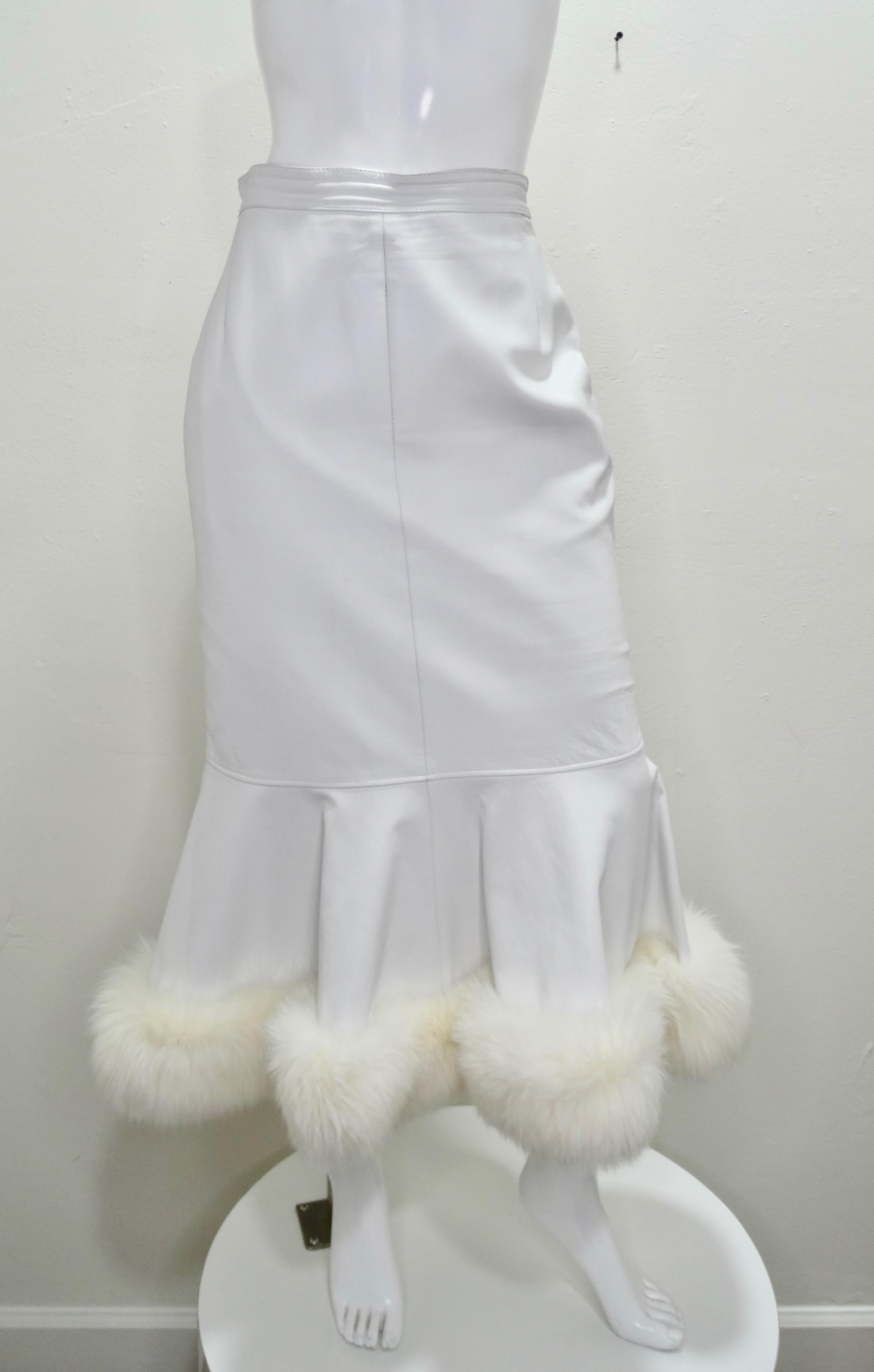 Feel All Of The 80s Vibes In This Leather Skirt! Circa 1980s, this custom couture numbered 10829 Jean Claude Jitrois skirt is crafted from white leather and features a peplum bottom with a fox fur trim and zipper/snap button closure on the back.