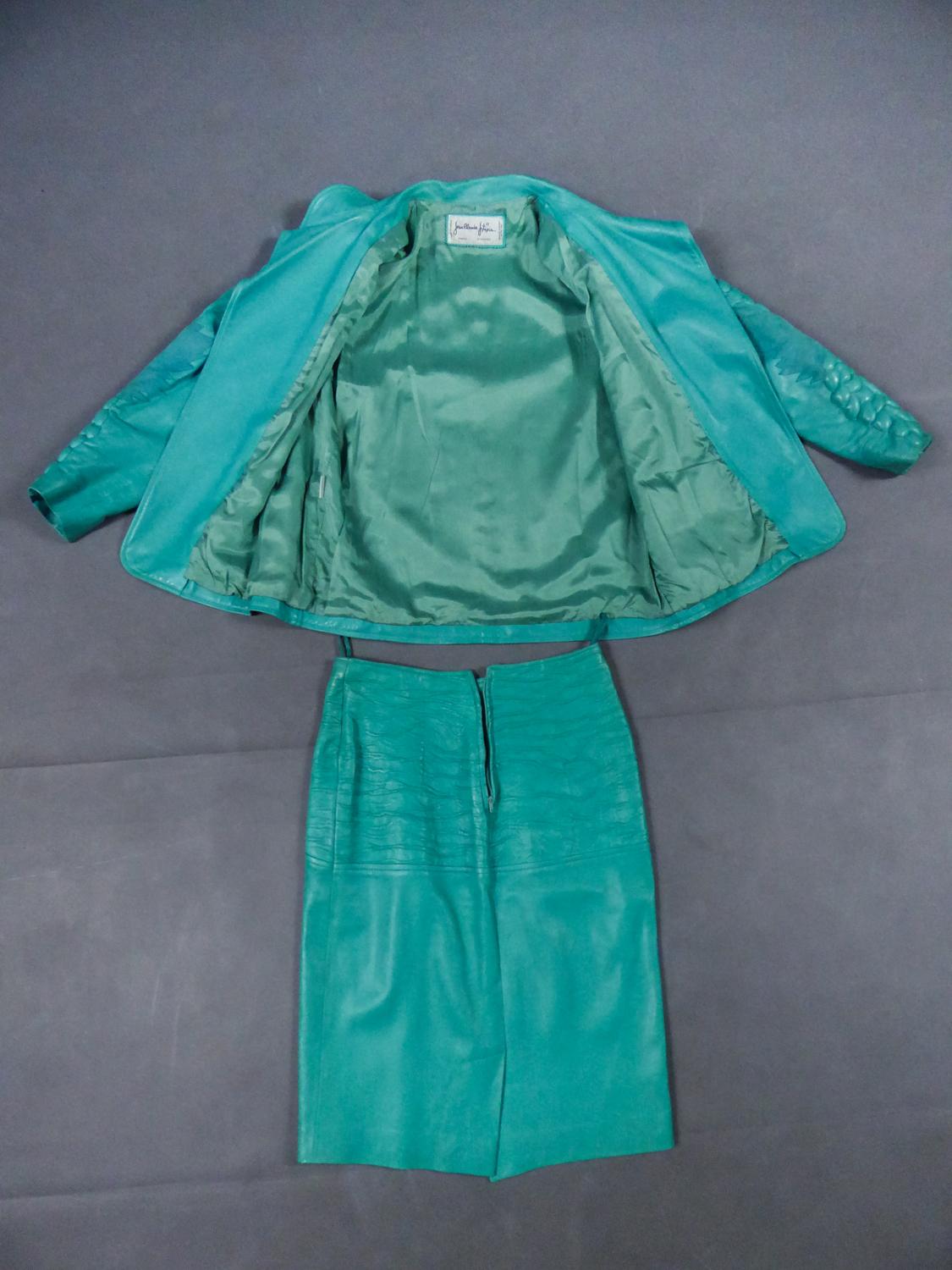 Collection Autumn Winter Fall 1985/1986
France

Skirt and jacket set in turquoise dipped lambskin by Jean-Claude Jitrois Collection Autumn Winter Fall 1985/1986. Jacket with small collar and leg of mutton sleeves with a quilted scales pattern