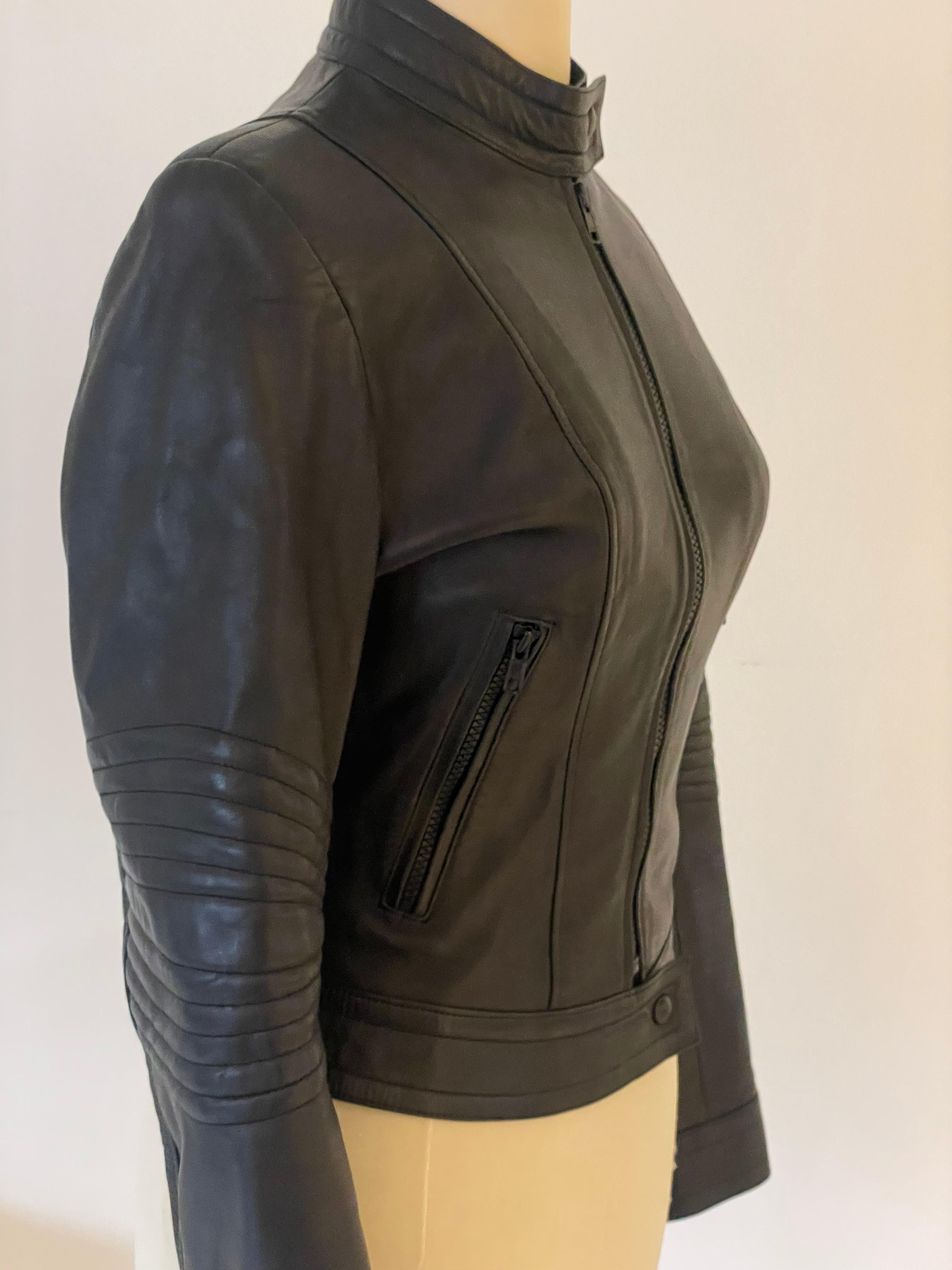 Very UNIQUE item this JEAN CLAUDE JITROIS vintage black leather ribbed MOTO BIKE JACKET from the 90s. Snap button collar. Zip front. Ribbed detailing at elbow. Jean-Claude Jitrois is a French fashion designer known for his work with leather. He is