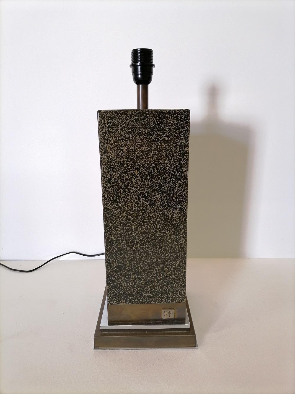 Jean Claude Mahey lacquer and brass table lamp, 1970, France

A big table lamp with black lacquer and golden glitters by the French designer
Jean-Claude Mahey

Original label with signature on the base 

Good condition

Shade not included.