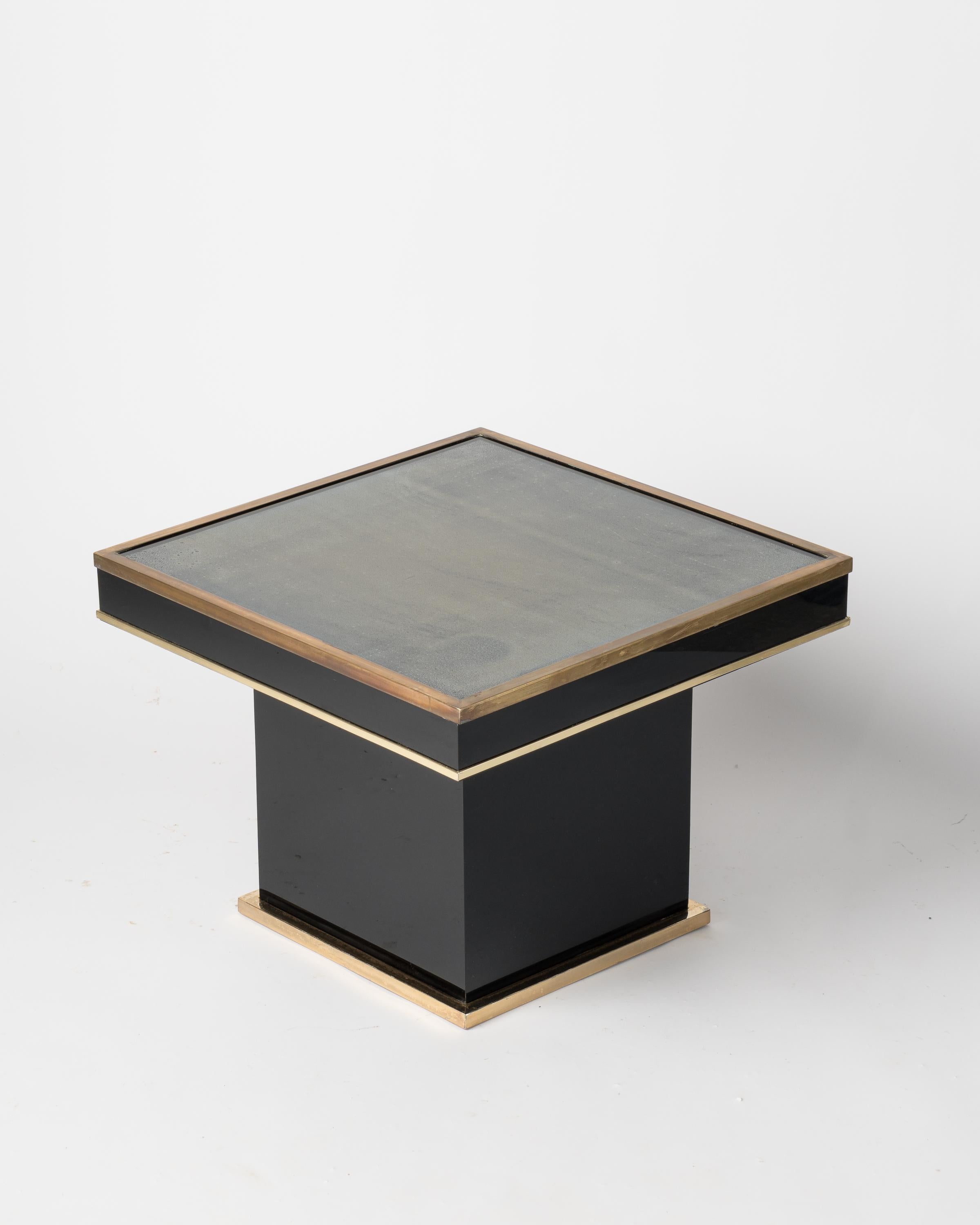 Black laminate, gilt and patinated brass side table.
Glass top has some minor scratches.
In overall good vintage condition.
some of the patina has been voluntarily left as is.
This table will ship from France and can be returned to either France