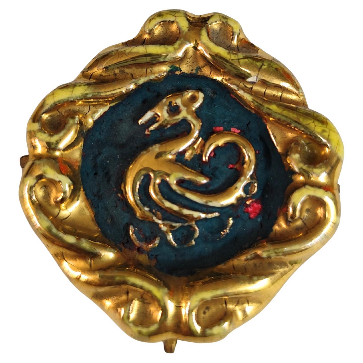 Broche de cerámica azul y dorada Jean Clément años 30 en venta