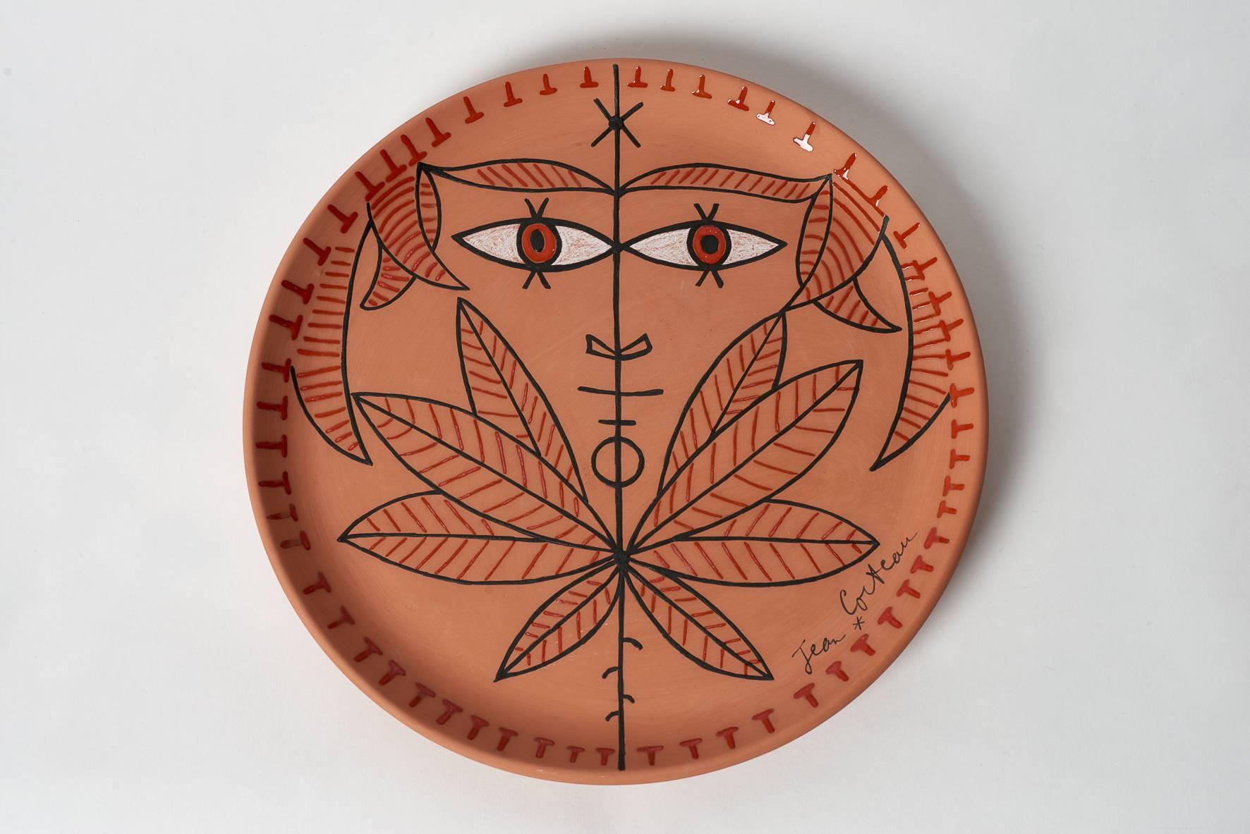 Jean Cocteau ceramic dish - Cornefeuilles, 1962
Edition originale Madeline & Jolly with certificat d'origine dated et signed from 1962.
Red earthenware with black / white/ orange enamel, measure: Diameter 33 cm.
Numbered 3 on 5 copies (Cornefeuilles