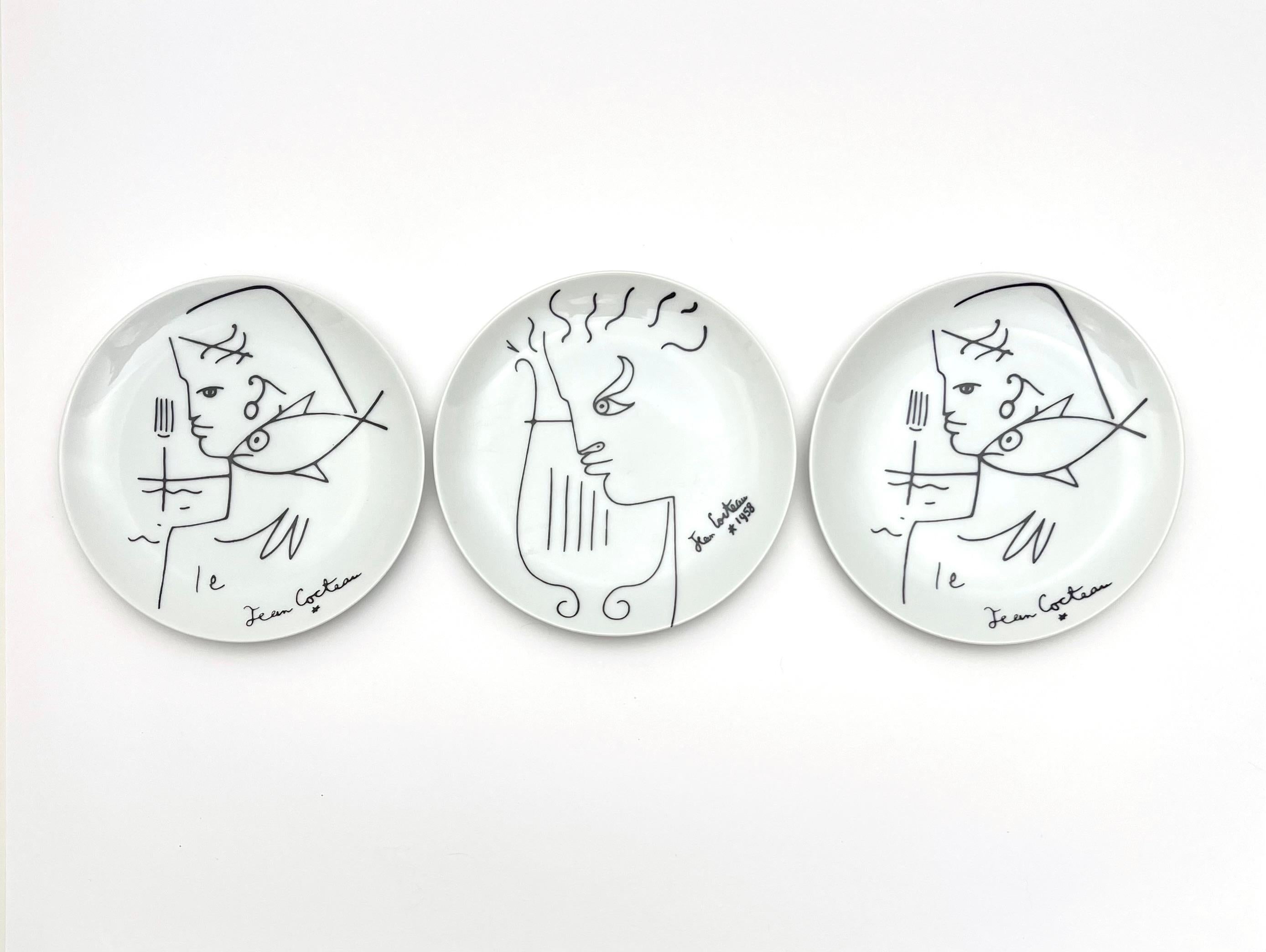 Fabulous set of 8 Jean Cocteau porcelain hor d'oeuvres or dessert plates for Limoges.  Four unique figural  drawings of ancient Greece from Orpheus and his harp to Eurydice.  One signed 1958 the year he created the drawings.
The set is three of one