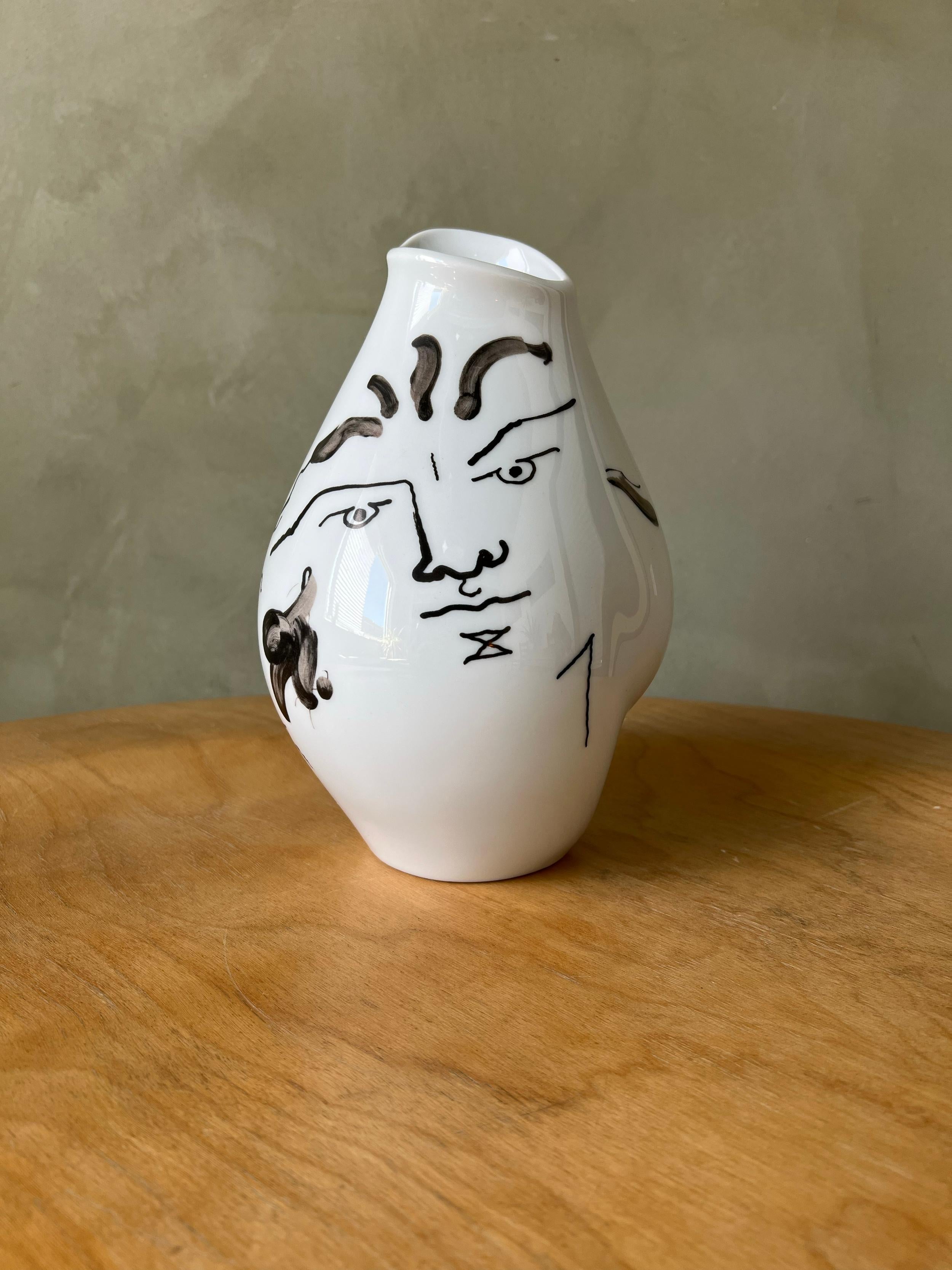 Vase designed by Jean Cocteau features two faces on opposite sides of the vase. In great condition, no chips or cracks. A beautiful example of a famous vase made by Rosenthal.