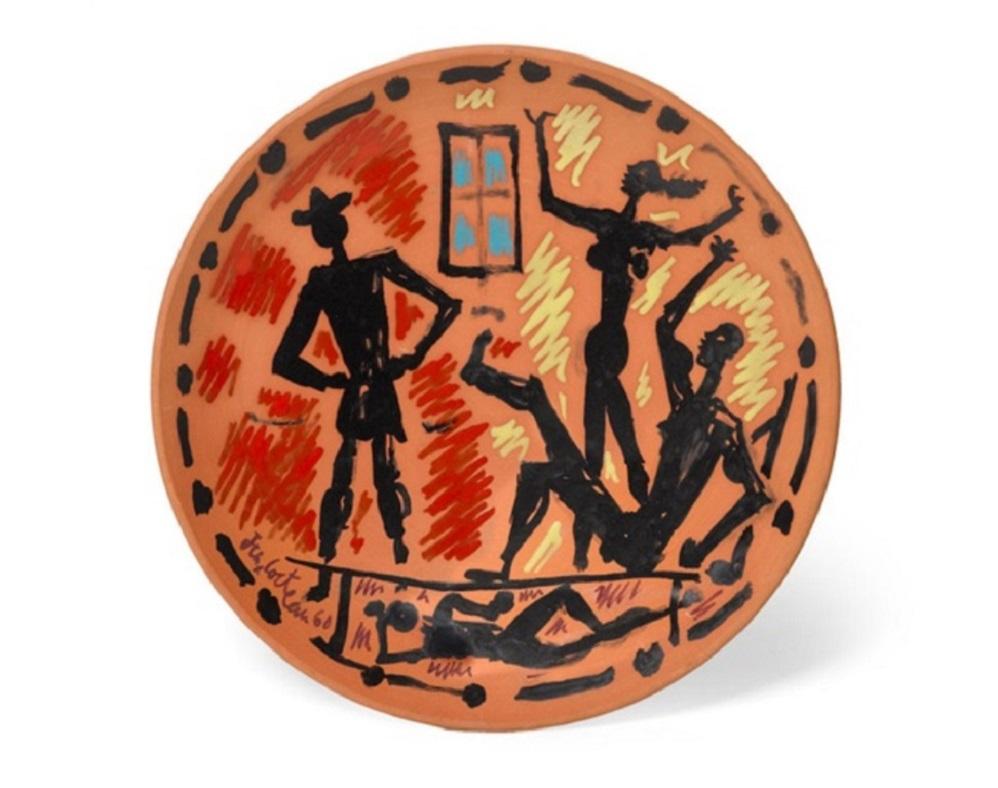 This Cocteau ceramic plate "Scène d'intérieur, from Le Satiricon" is one in an edition of 15 and is made of red earthenware round dish, painted in colors, with touches of enamel. This piece is signed and marked on the reverse, This piece is in