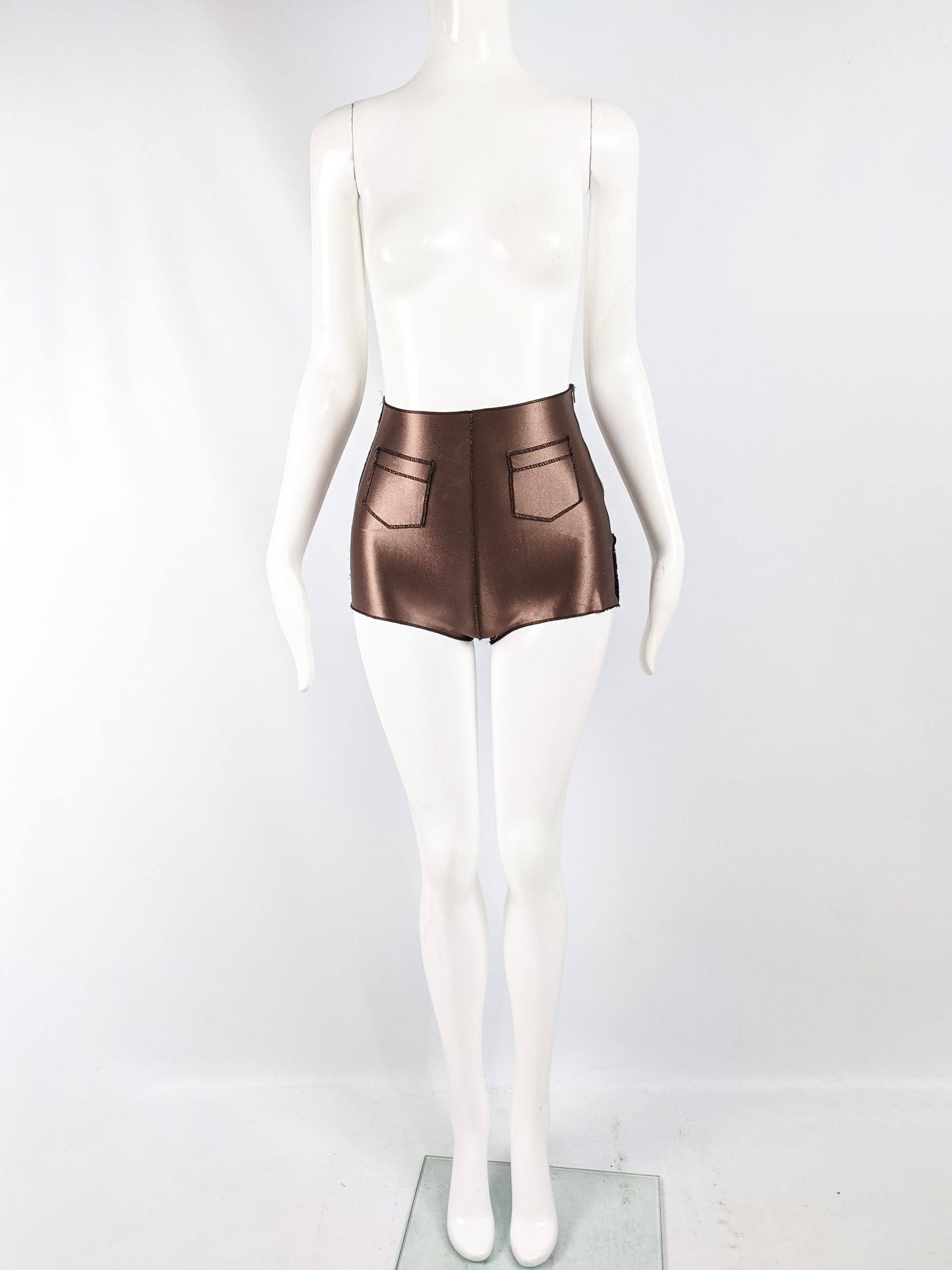 A fabulous pair of vintage hot pants by cult French fashion designer, Jean Colonna. In a bronze satin fabric with exposed flatlock seams and a high waist. 

Size: Marked M but measures like a modern XS / UK 6/ US 2. Please check measurements. 
Waist