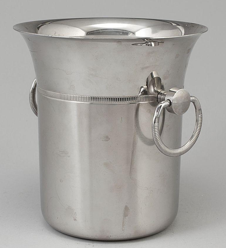 Stunning vintage French small Jean Couzon stainless steel Champagne ice bucket.
Jean Couzon 18/10 stainless steel wine bucket is well made and heavy with a sleek design and ring handles.
Satin bottom and shiny top, separated by a gadroon frieze.
A