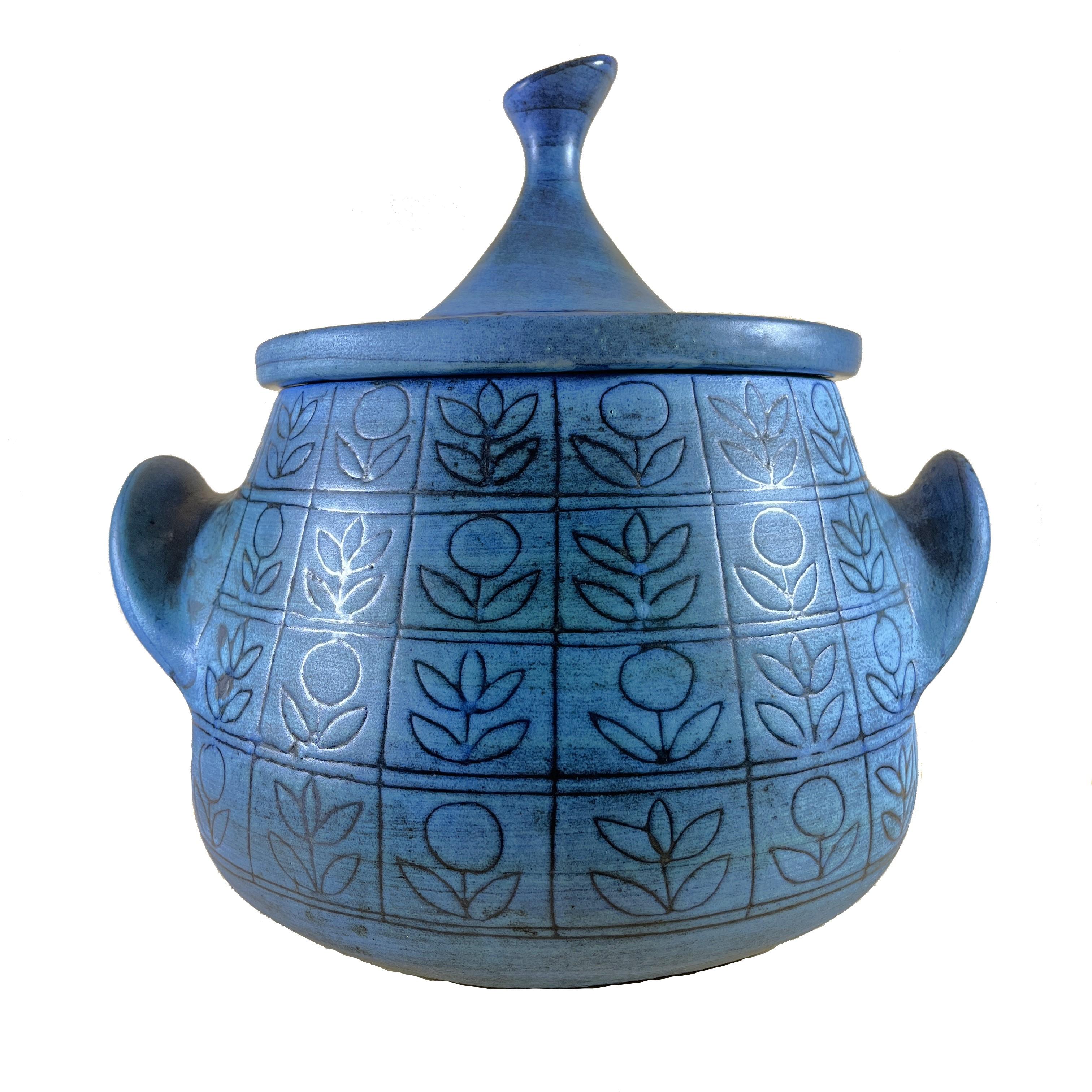 An exceptional large tureen in mate glazed blue ceramic made in Nice in the 1950s/1960s, signed by Jean de Lespinasse (1896-1979).

It presents a beautiful organic decor created by the combination of stripes with flower patterns that contrast with